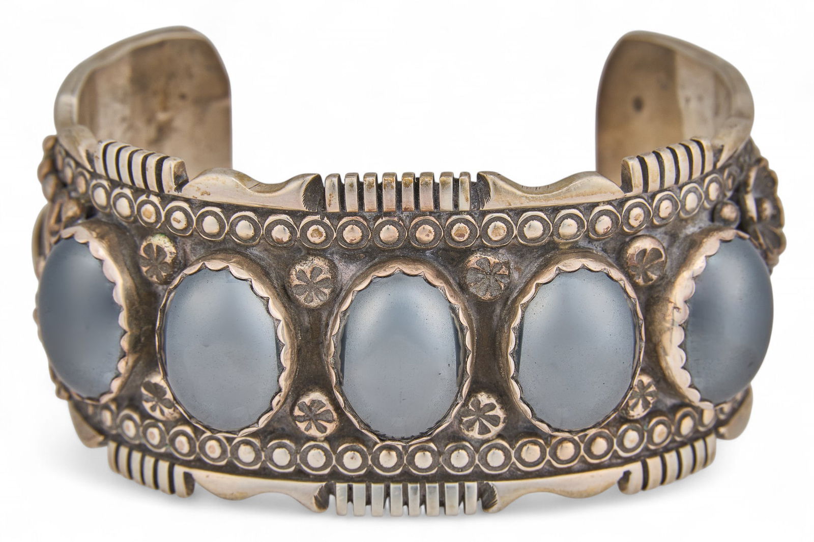 Navajo Sterling Silver and Tourmaline Cuff: Sterling silver "Indian pawn" cuff inlaid with black tourmaline, marked "A C, Sterling", circa 1920s circumference: 6 in. total weight: 2.45 ozt Provenance: Property fr