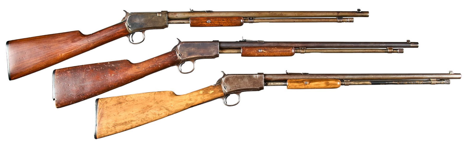 Lot of 3 Winchester Model 1906 22 Cal. Slide Action Rifles: Serial: (1) 278963; (2) 276452; (3) 54320 Manufacturer: Winchester Repeating Arms Co. (1 & 2) c. 1912; (3) 1907 Model: 1906 Caliber: (1 & 2) 22 LR; (3) 22 Short Condition: All are in Fair/As-i