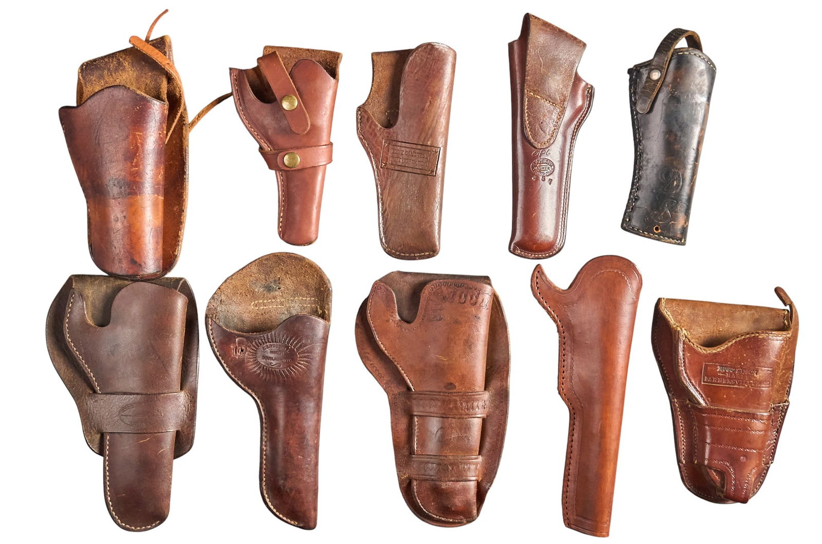 Collection of 10 Vintage Leather Holsters: Collection of 10 vintage leather holsters Features: (1) cursive "D / S" initialed holster; (2) unmarked Colt Army/Navy percussion holster; (3) J. H. Heiser - Denver, Colo.; (4) Hugo Simon -