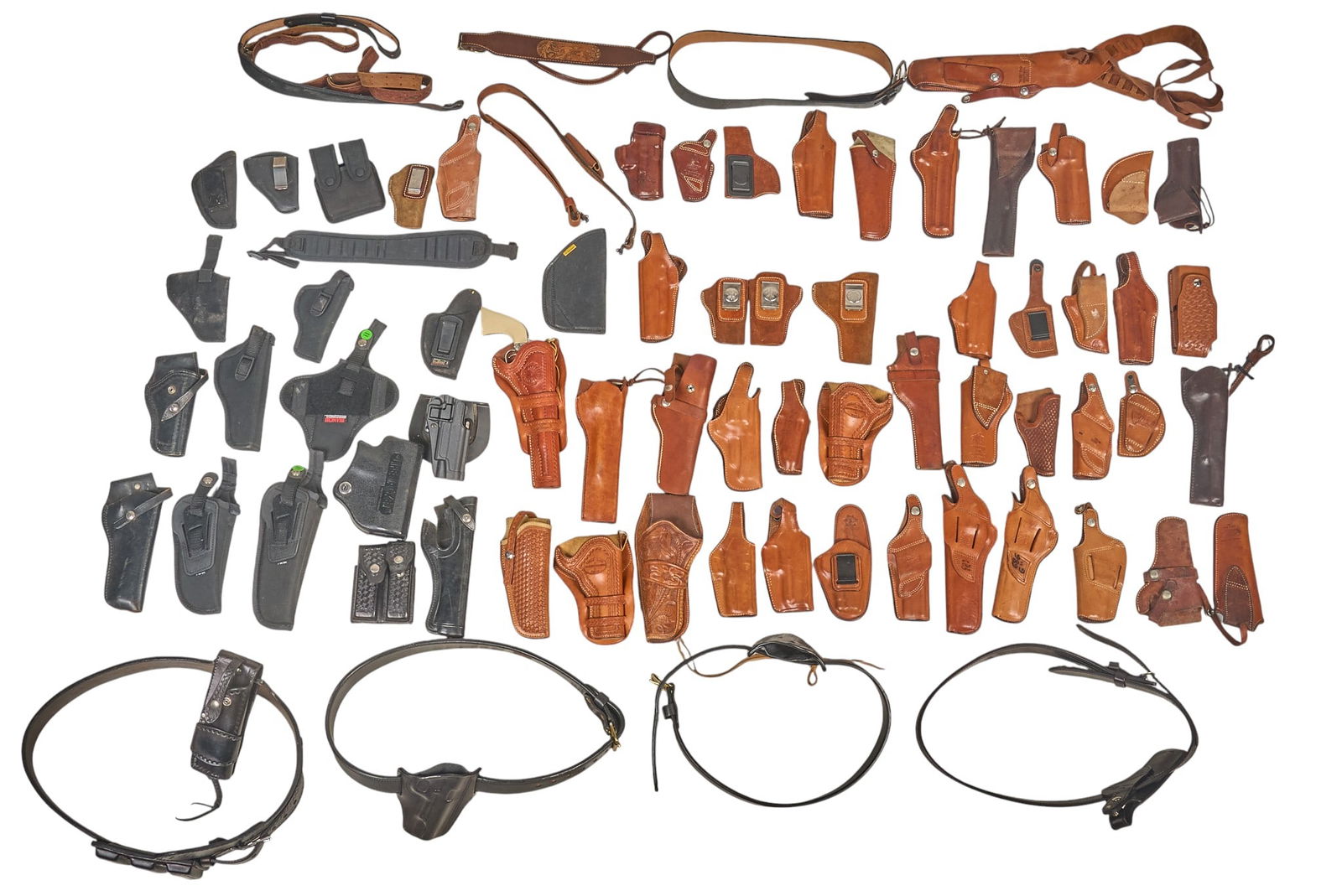 Collection of 79 Holsters & Belts: Includes -64 Leather Belts, slings & holsters -15 Holsters, slings & pouches Including Bianchi, Blackhawk, Uncle Mike's, El Paso Saddlery Co. & Don Hume 8 x 17 x 14