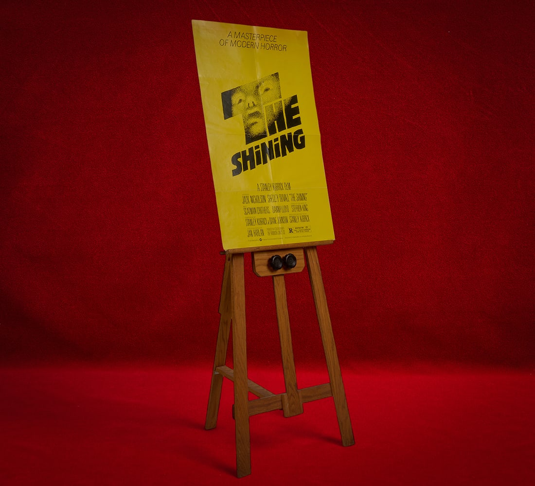 Shelley Duvall | "The Shining" Movie Poster: Original one-sheet movie poster for "The Shining" (1980), produced by Warner Bros. Inc. to promote the theatrical release of the movie and originally displayed in a glass-enclosed poster cas