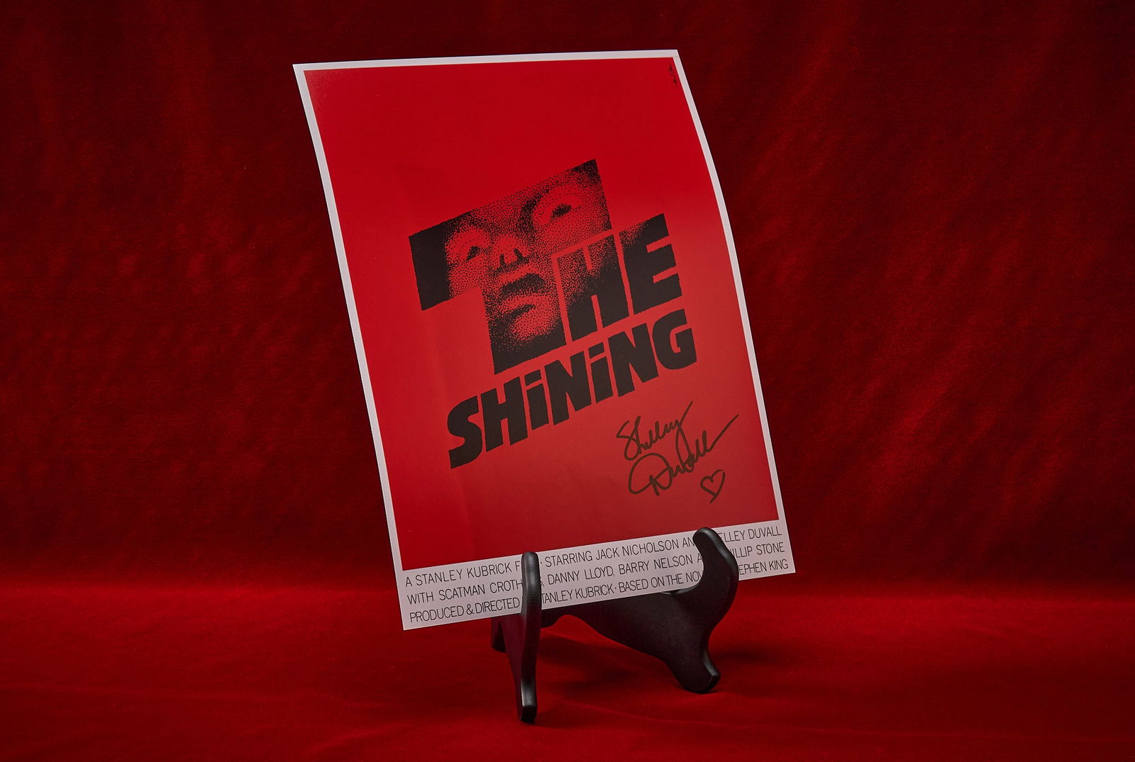 Shelley Duvall | Signed "The Shining" Poster: Collectible movie poster print for "The Shining" (1980), featuring alternative red color scheme as used as the album art for the soundtrack, signed by Shelley Duvall who played Wendy To