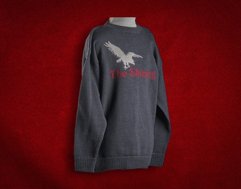 Shelley Duvall | "The Shining" Sweater: Custom fan-made sweater celebrating "The Shining" (1980), featuring custom embroidery of a bird graphic above stylized text reading "The Shining", wool, Ritva Ross (London) Provena