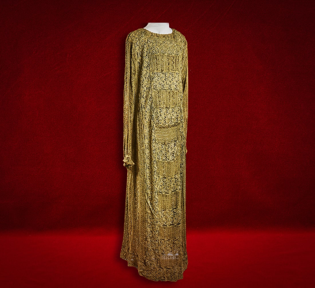 Shelley Duvall | Dress: Full-length bohemian style olive crochet lace gown, from the personal wardrobe of Shelley Duvall, with intricate scrollwork, sheer long sleeves, scalloped edges, intricate openwork floral and scroll p