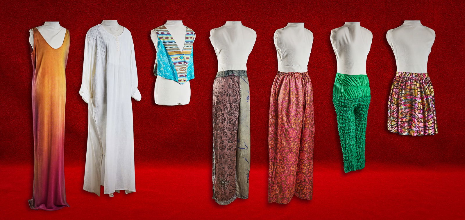 Shelley Duvall | Clothing: Collection of vintage clothing from the personal wardrobe of Shelley Duvall, including sunset ombre gown, long dresses, patterned skirts, wide-leg trousers, a colorful woven vest and a white cotton ka