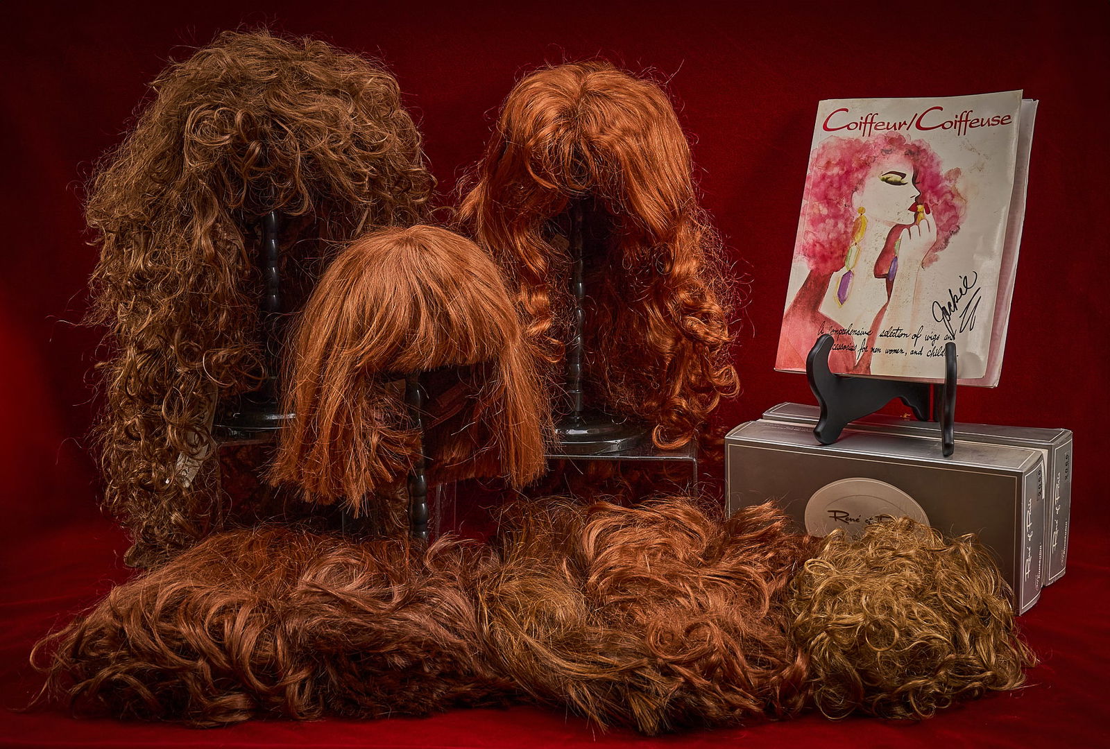 Shelley Duvall | Theatrical Wigs: Collection of Shelley Duvall's theatrical wigs, predominantly by Rene of Paris, some boxed, some in original bags, also includes original catalog signed "Jackie" Provenance: Property fro