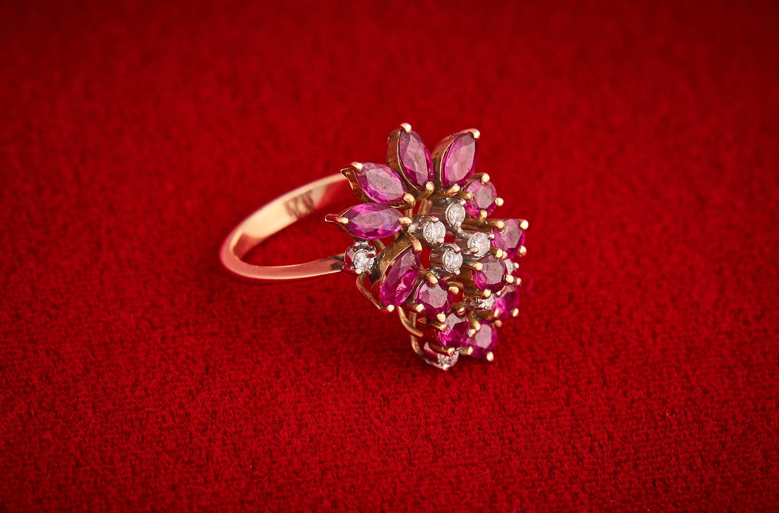 Shelley Duvall | Cocktail Ring: 14K yellow gold cocktail ring, floral cluster consisting of rubies and diamonds, marked "14K", size 6.75 Total weight: 5g Provenance: Property from the personal estate of celebrated actress