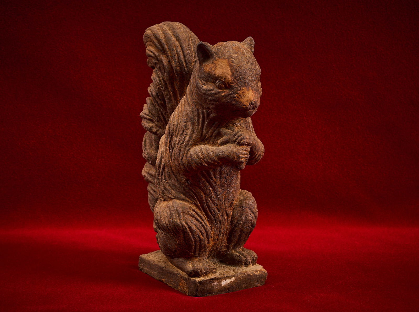 Shelley Duvall | Squirrel Doorstop: Cast iron dimensional figure / doorstop of a squirrel perched upright with detailed fur texture, naturally aged rust brown patina height 8.5 in. x width 6 in. x depth 3.5 in. Provenance: Property from