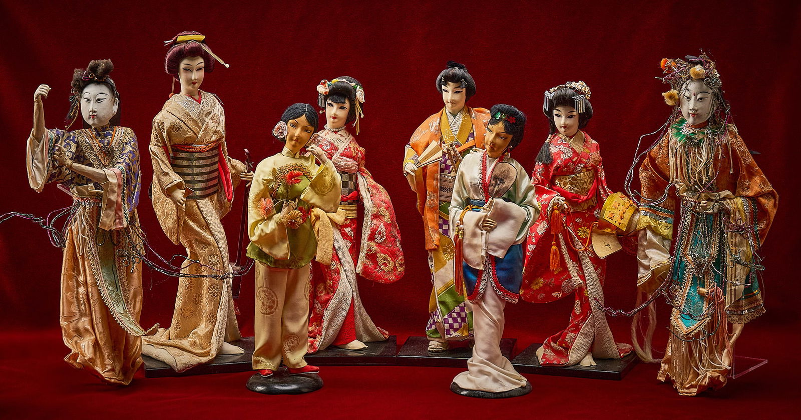 Shelley Duvall | Asian Dolls: Collection of Asian figural dolls, each elaborately costumed with several holding accessories, mid-20th century, includes photograph of Shelley Duvall with the figures in her Los Angeles, California h