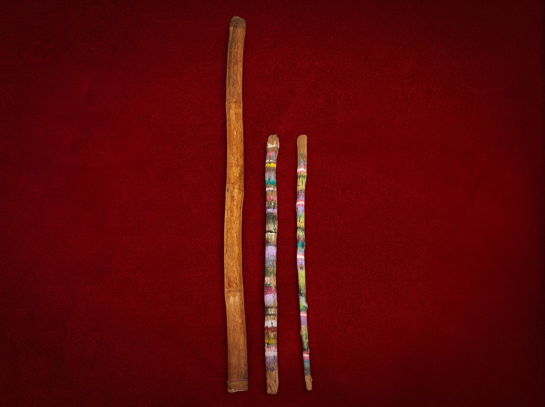 Shelley Duvall | Sticks: Handcrafted wooden sticks, including (2) rain sticks with hand-painted folk art colorful banding and one larger primitive wooden walking stick walking stick: height 60 in. x diameter 3 in. Prove