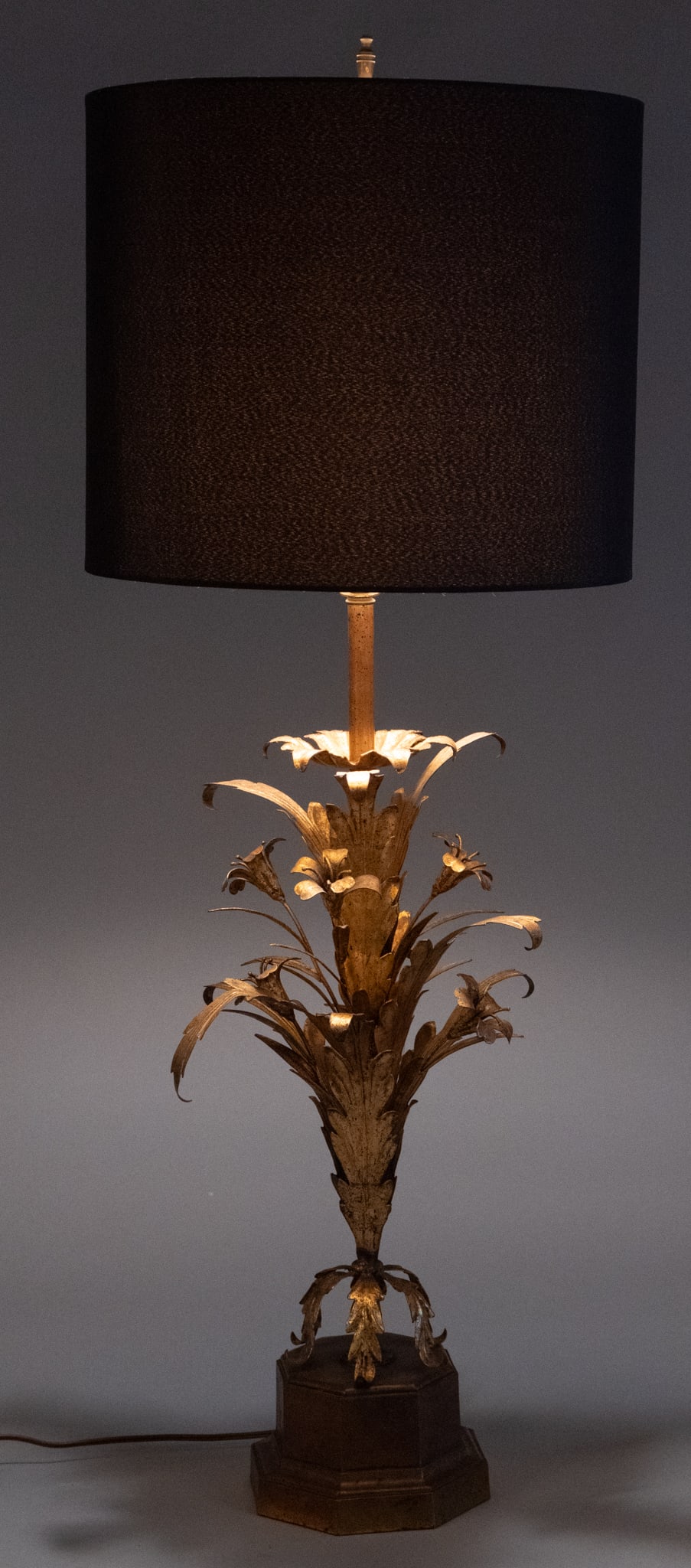 Frederick Cooper Gilt Floral Lamp: Vintage Frederick Cooper table lamp with tin foliate motifs with gold finish and black fabric shade, in working condition height 40.5 in. x width 16 in. x depth 16 in.