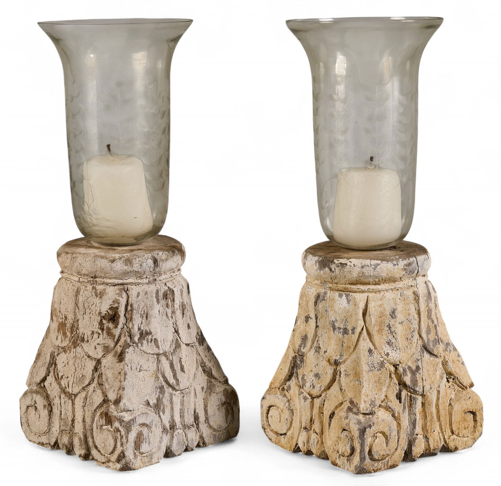 Pair of Carved Wood and Glass Candle Holders: Pair of candle holders with carved wood bases and glass hurricane shades height 20.75 in. x width 8 in. x depth 8 in. / each Provenance: Property from a home in San Antonio, Texas