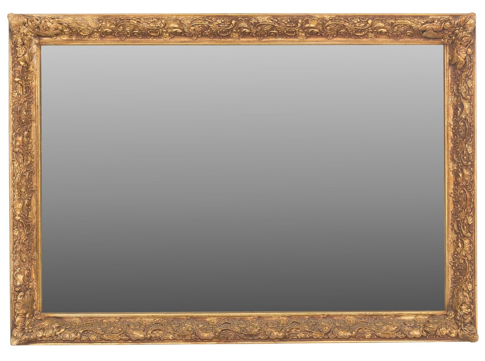Giltwood Mirror: Rectangular mirror with an ornate giltwood frame height 29 in. x width 41 in. x depth 3 in. Provenance: Property from a home in San Antonio, Texas 