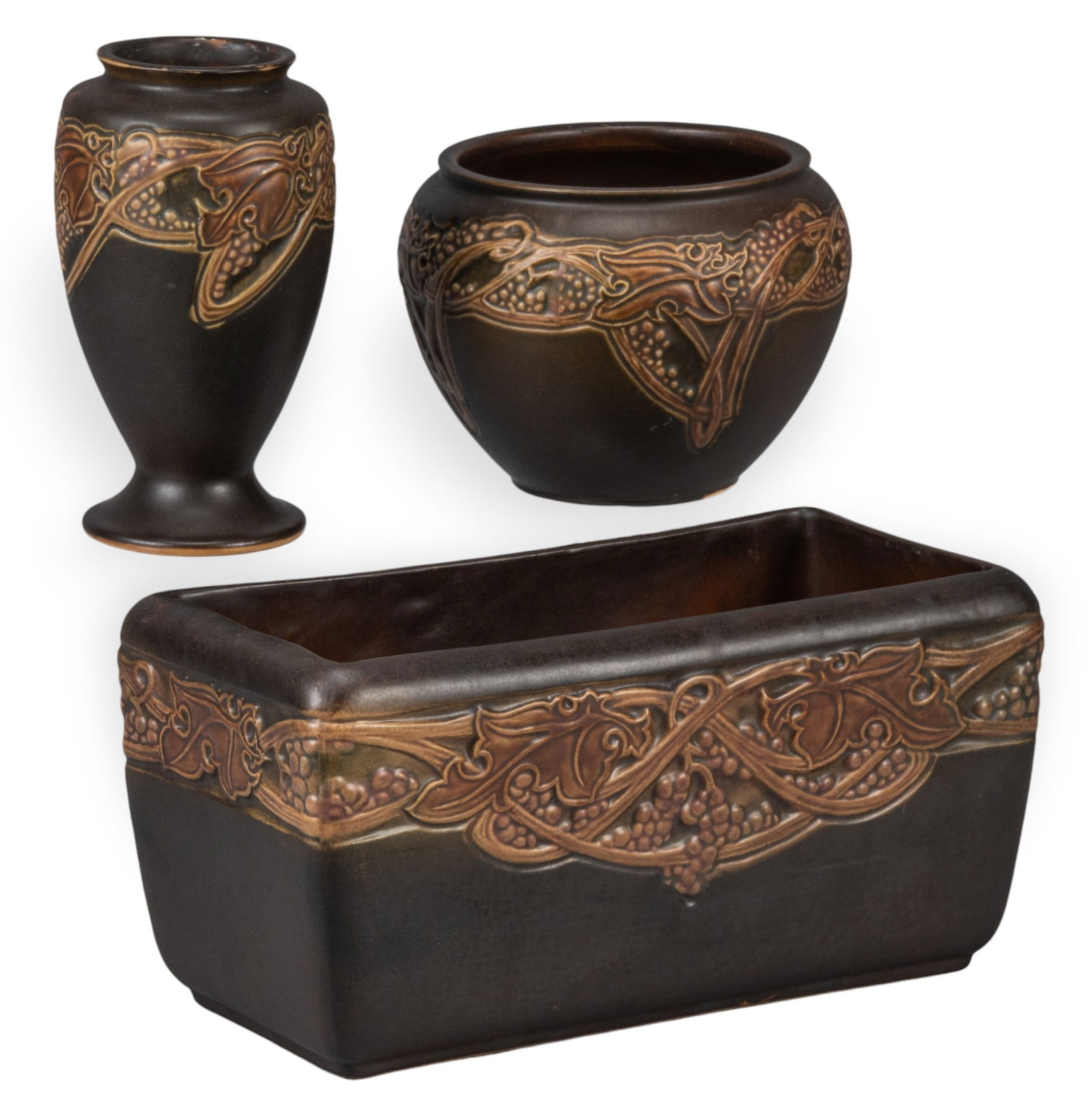 Collection of Roseville Pottery: Collection of Roseville pottery to include two vases and a planter height 6 in. x width 12 in. x depth 6 in. Provenance: Property from a home in New Braunfels, Texas