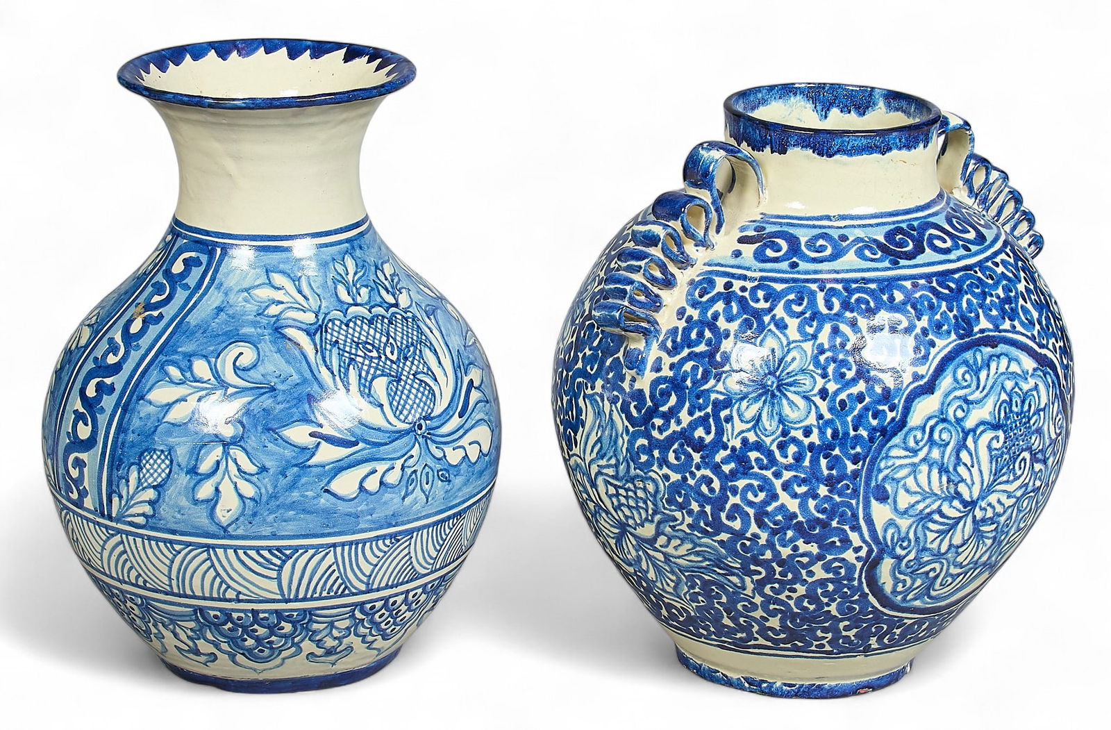 (2) Large Blue and White Talavera Vases: Two hand-sculpted and painted Talavera vases, with blue and white floral motifs to exterior, circa 20th century height 17.5 in. x width 13 in. x depth 13 in.