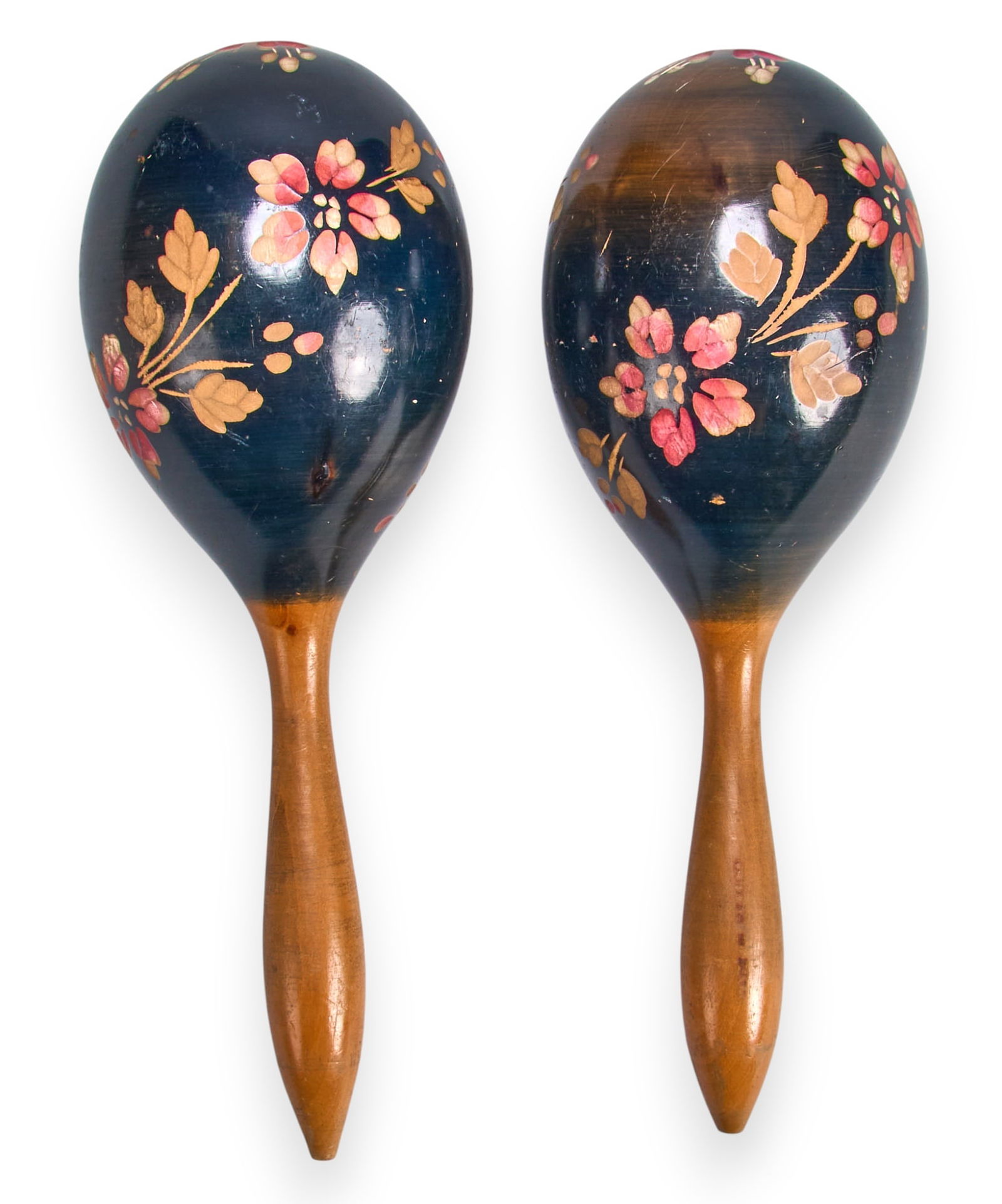 Pair of Lacquered Floral Maracas: Pair of vintage lacquered maracas with carved and painted pink floral motifs, circa 1940s length 10 in. x diameter 3.25 in. / each Provenance: Property from the noted Latin American arts collecti