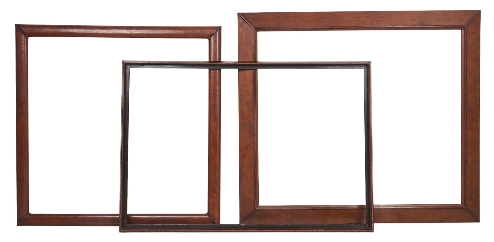 (3) Large Frames: Three large, various wooden frames with leather detailing height 75 in. x width 51 in. x depth 3 in. / largest Provenance: Property from a home in San Antonio, Texas