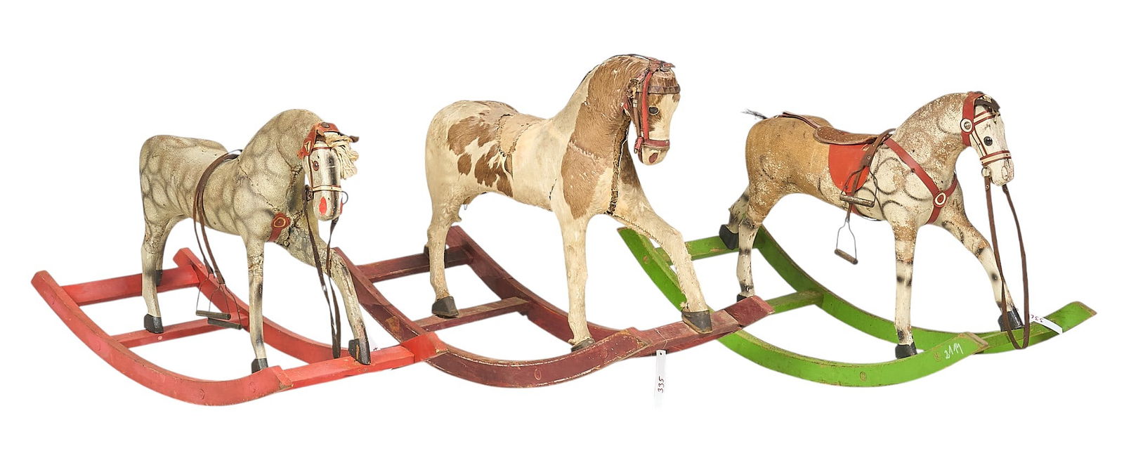 (3) Vintage Rocking Horses: Group of three vintage rocking horses with canvas boddies, and one with hair on hide details, on wooden legs height 27 in. x width 47 in. x depth 15 in. / largest 