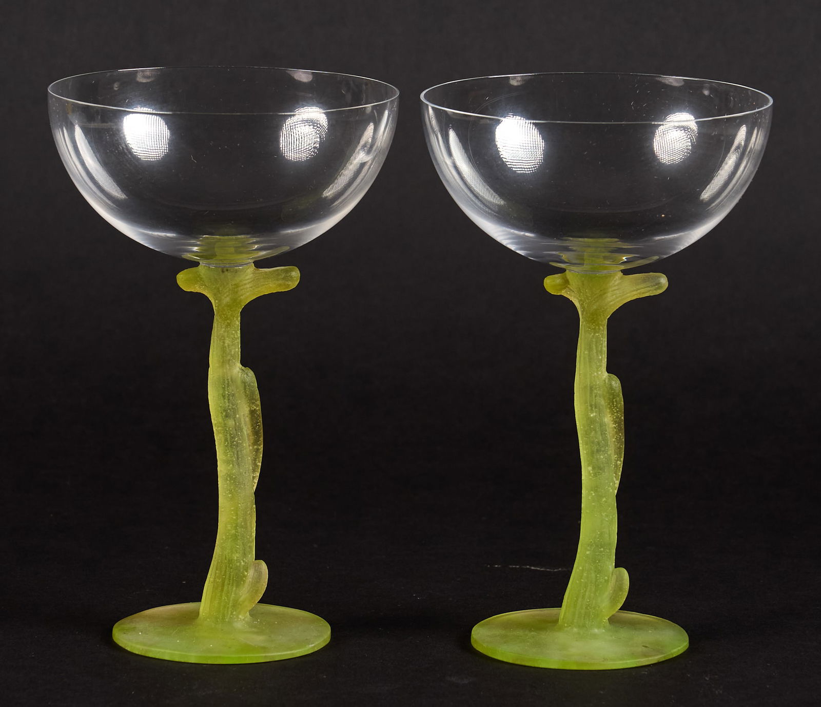 Pair of Daum Pate-de-Verre Stem Coupes: Pair of Daum pate-de-verre stem coupes designed by Hilton McConnico (American, 1943-2018), each featuring a clear-blown glass bowl supported on a sculptural chartreuse pate-de-verre organic stem, each