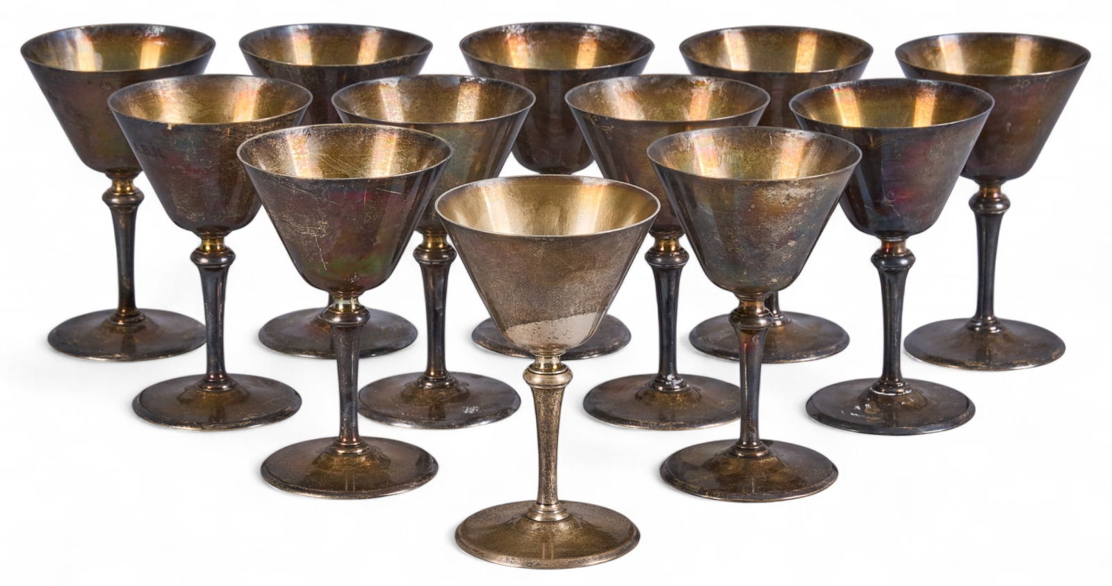 (12) Tiffany & Co. Sterling Cocktail Goblets: Matched set of twelve Tiffany & Co. sterling silver cocktail goblets, each with flared bowl, gilt interior and tapered stem, monogrammed "ABN", marked, circa 1907-1947 (Edward C. Mo