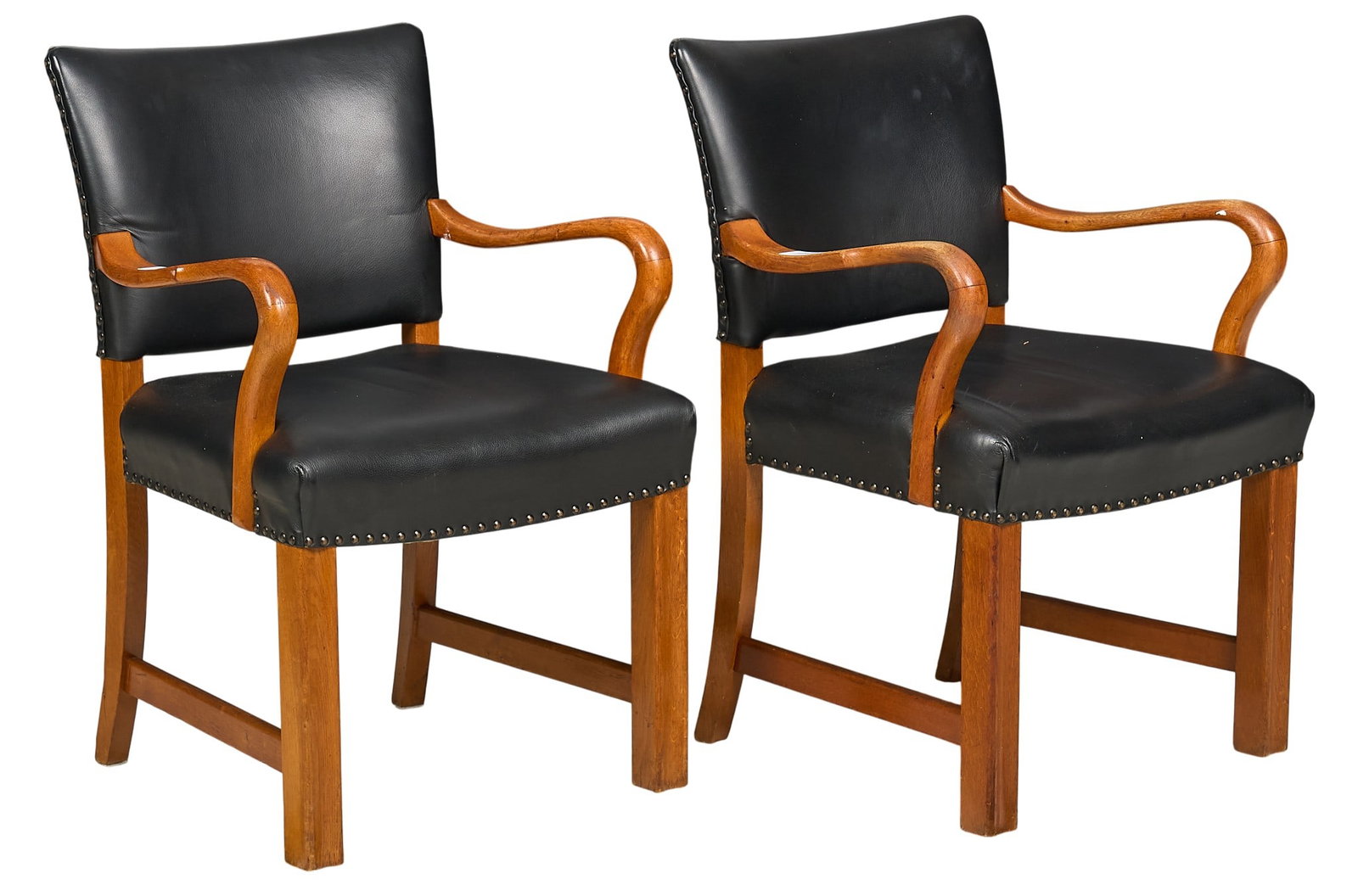 Pair of Danish Mid-Century Armchairs: Pair of Danish mid-century armchairs with black leather upholstery, and bentwood armrests, supported on block legs height 36 in. x 23 in. x depth 20 in. 