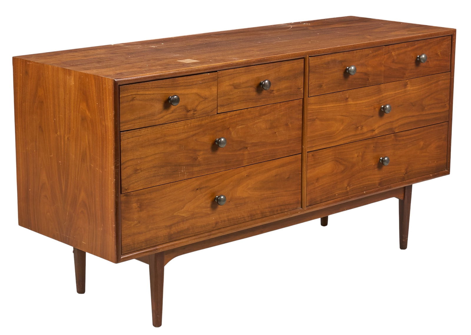 Kipp Stewart for Drexel Walnut Dresser: Walnut dresser, designed by Kipp Stewart (American, 1928-2022) for Drexel Furniture's "Declaration" line, with four small drawers above four large drawers, on pin legs, marked with Drexe