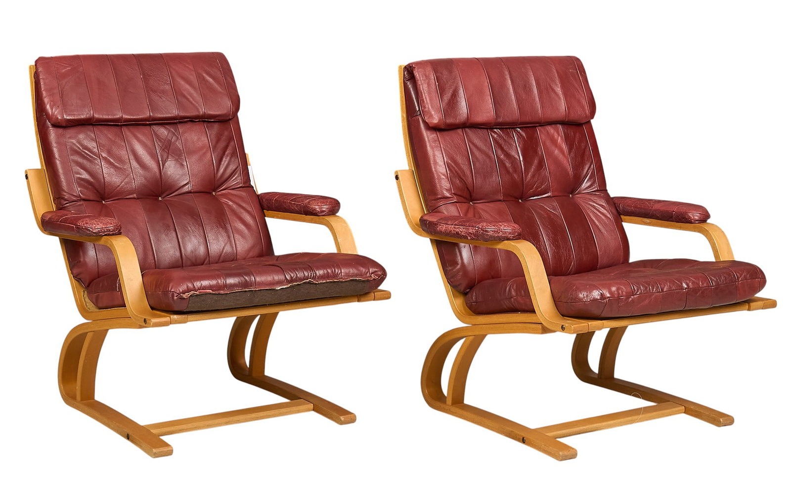 Pair of Danish Mid-Century Lounge Chairs: Pair of Danish mid-century lounge chairs with red leather cushions, supported on bentwood legs height 37 in. x width 31 in. x depth 37 in. 
