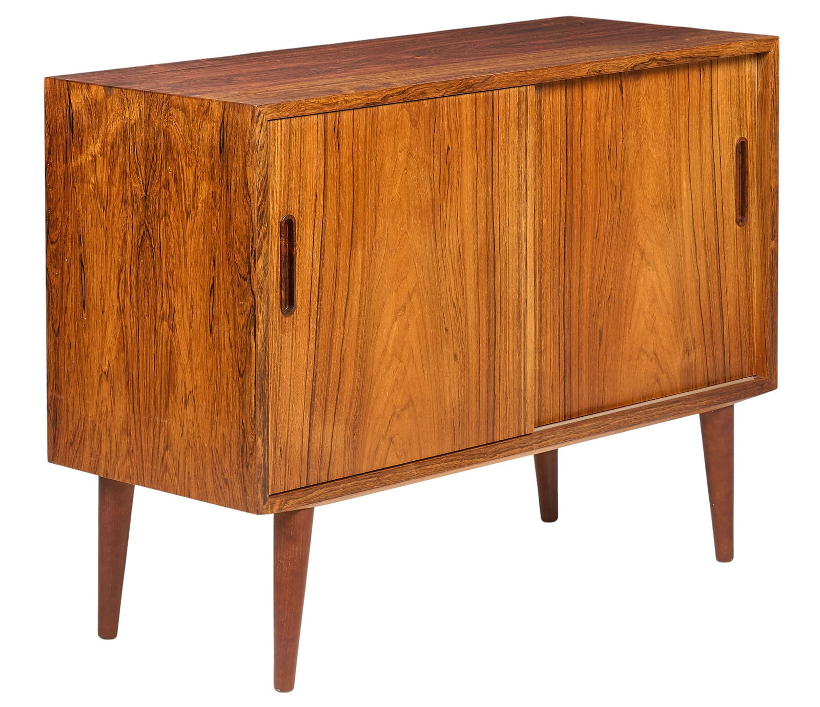 Small Danish Mid-Century Credenza: Small Danish mid-century credenza with two sliding doors opening to shelving and a small drawer, raised on splayed pin legs height 31.5 in. x width 42 in. x depth 17 in.
