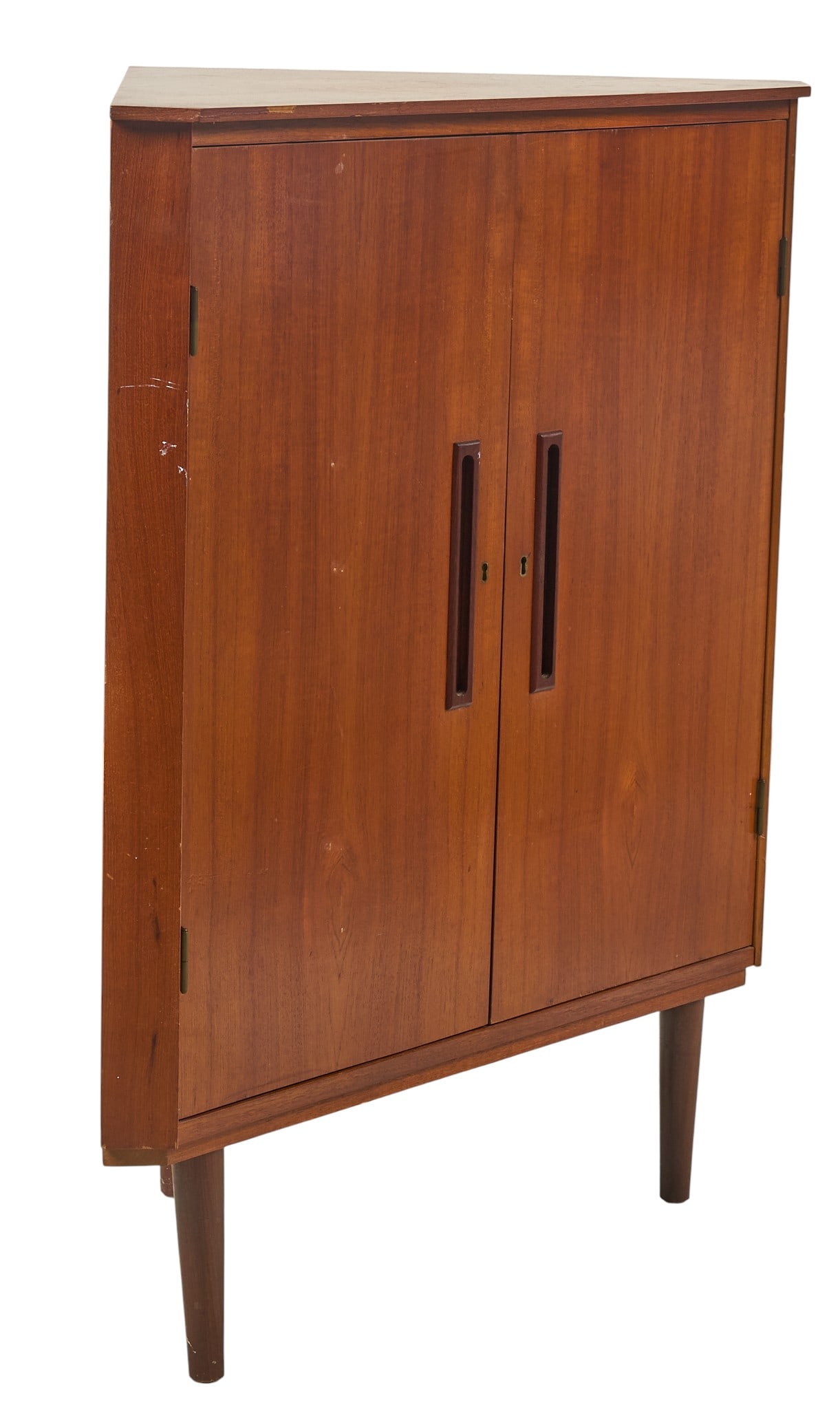 Mid-Century Corner Cabinet: Mid-century corner cabinet, with two cabinet doors opening to shelving, doors with integrated wooden pulls, with key height 42 in. x width 35 in. x depth 19 in. Provenance: Property from a home i