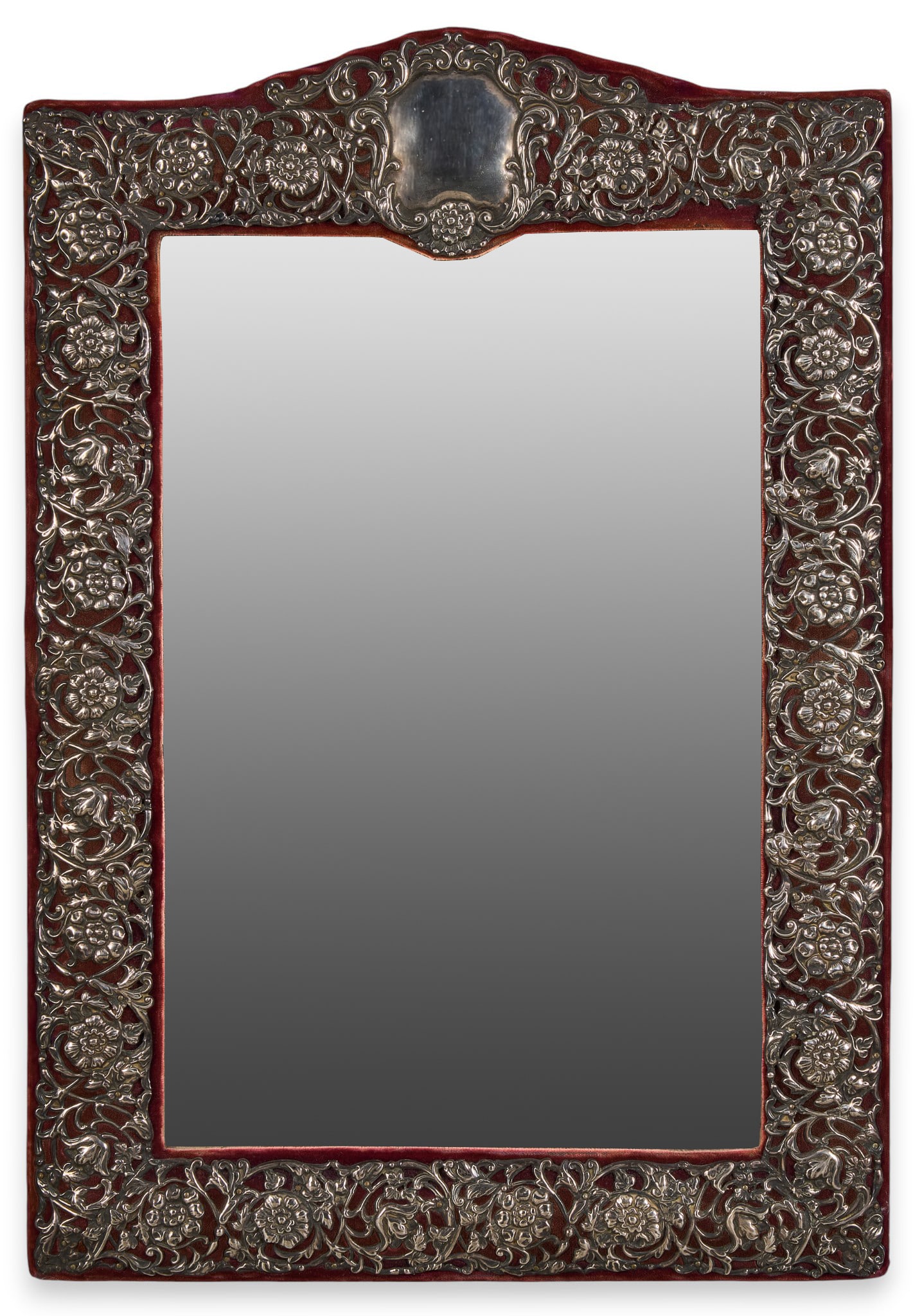 Antique Reticulated Sterling Mirror: Antique mirror with frame clad in red velvet, and decorated with reticulated English sterling silver metal applique pinned to frame height 22.75 in. x width 15.75 in. x depth 1.5 in. Provenance: Prope
