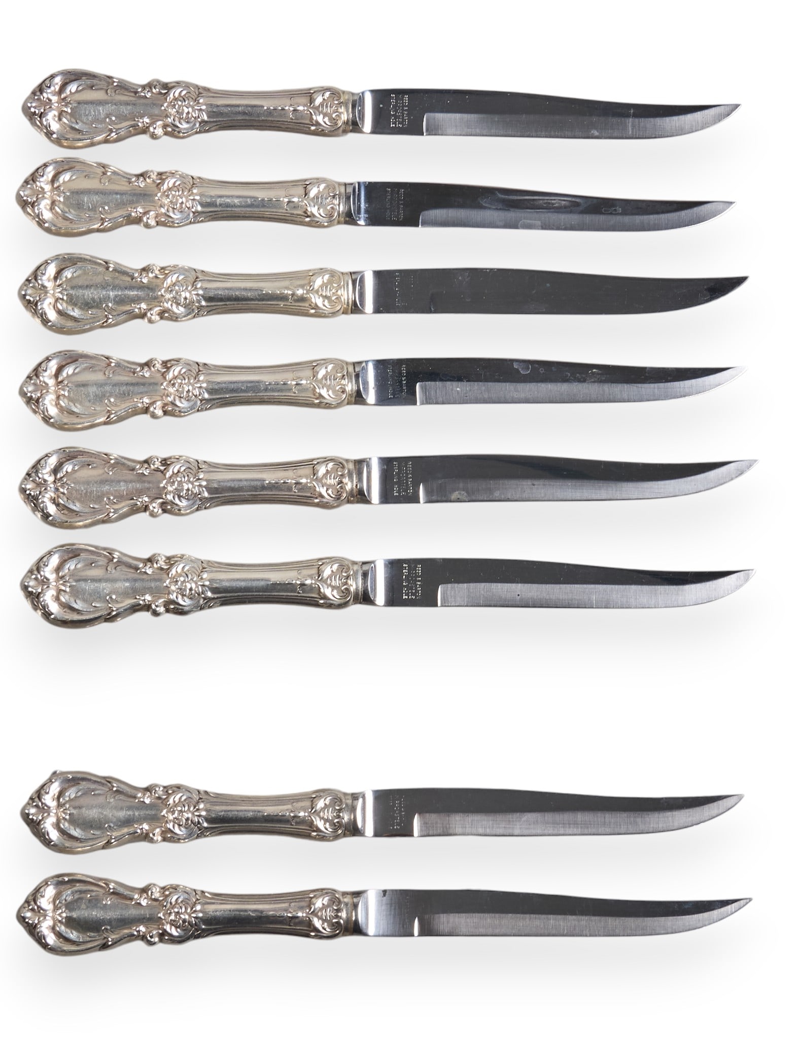 (8) Reed & Barton "Francis I" Steak Knives: Set of eight "Francis I" steak knives, by Reed & Barton, with repousse design, no monogram or removal, stainless blades, marked "Reed & Barton Sterling Hdle" Length: 8.75 i