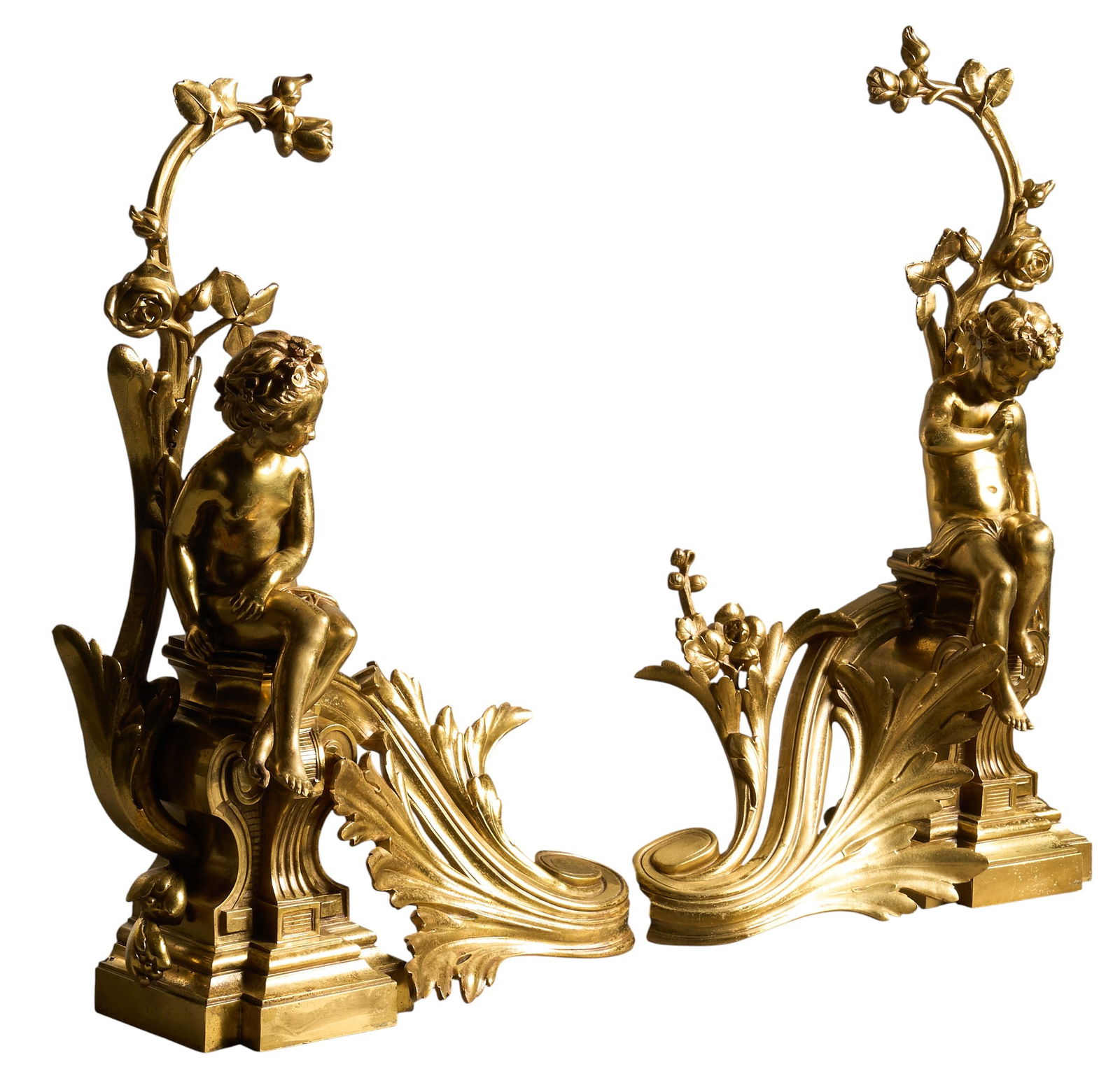 Pair of Louis XV Style Garnitures: Pair of gold-toned brass Louis XV style garnitures with putti figures height 21 in. x width 14 in. x depth 5 in. / each Provenance: Property from a prominent Nuevo Laredo, Mexico family involved