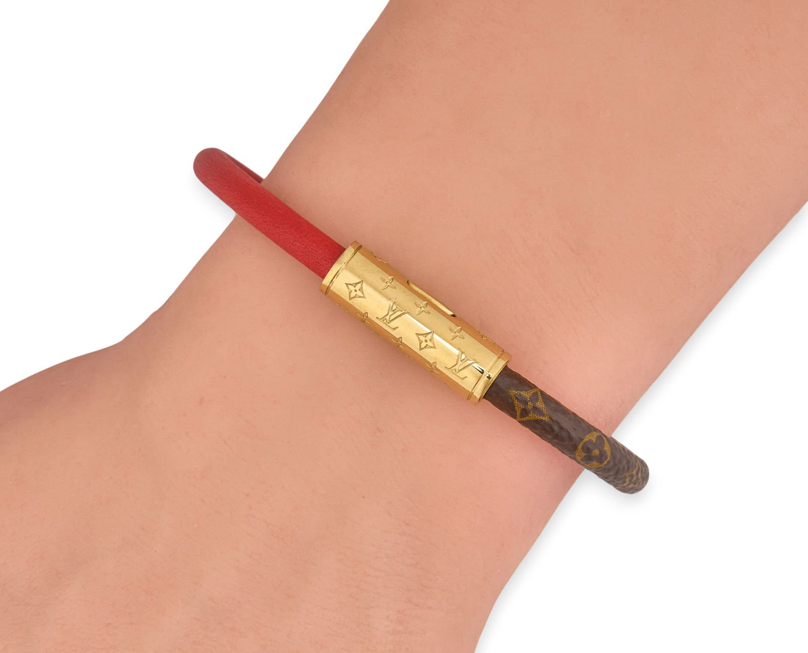 Louis Vuitton "Daily Confidential" Bracelet: Louis Vuitton "Daily Confidential" bracelet combining monogram canvas with red calf leather and silver tone clasp Length: 6.75 in. Provenance: Property from the Dominion home