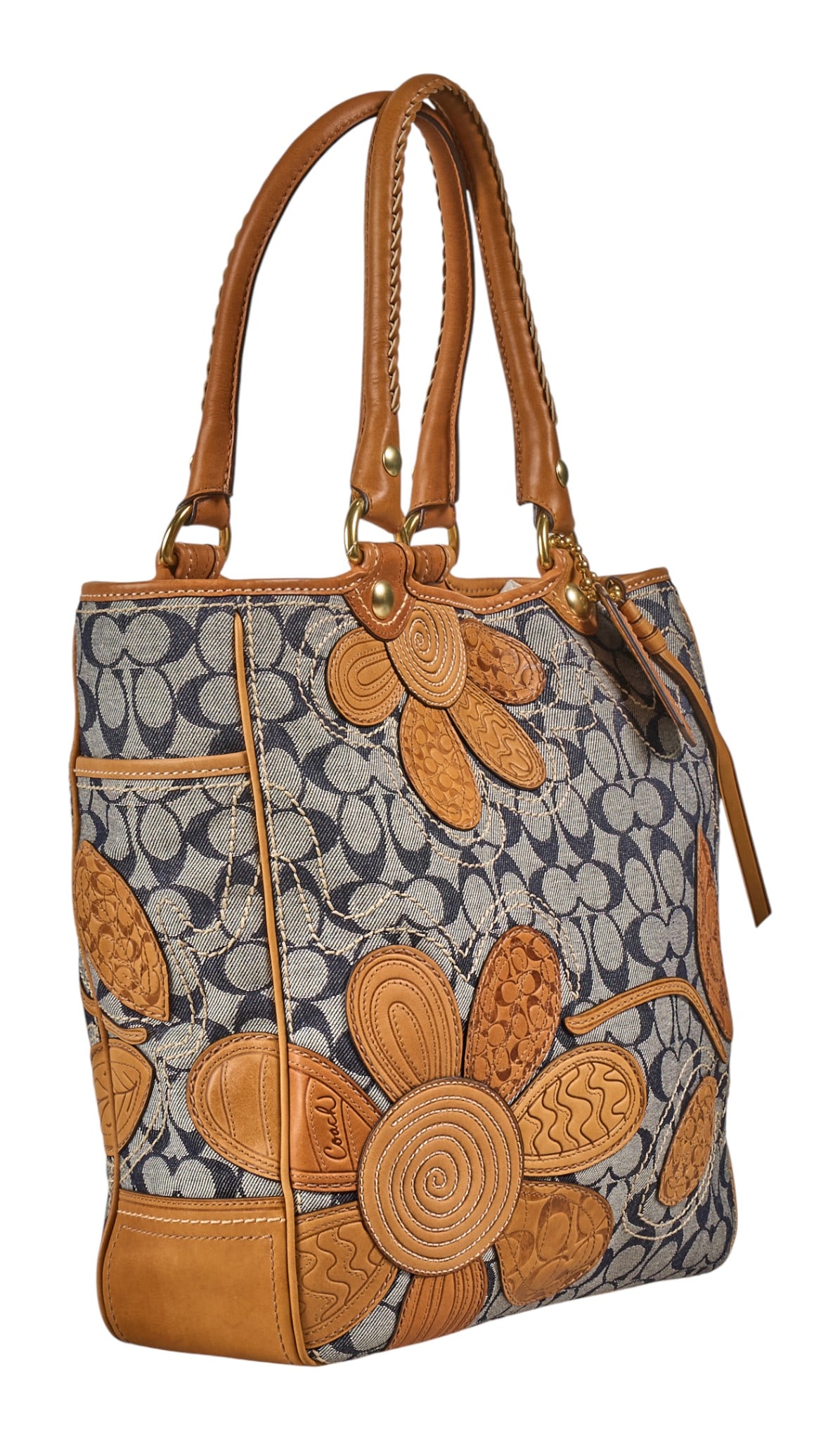 Coach Bleeker Floral Denim Tote: Coach Bleeker Floral Denim tote bag of stamped brown leather and monogram denim, with brown leather handles, and gold-toned hardware, marked with serial number "L0773-11783 14 in. x 16 in. x 5 in