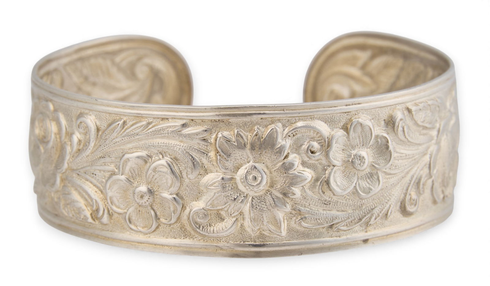 Sterling Silver Repousse Cuff: Sterling silver cuff, with repousse floral design, marked "S. Kirk & Son Sterling" Circumference: 7.5 in.Total weight: 1.035 ozt