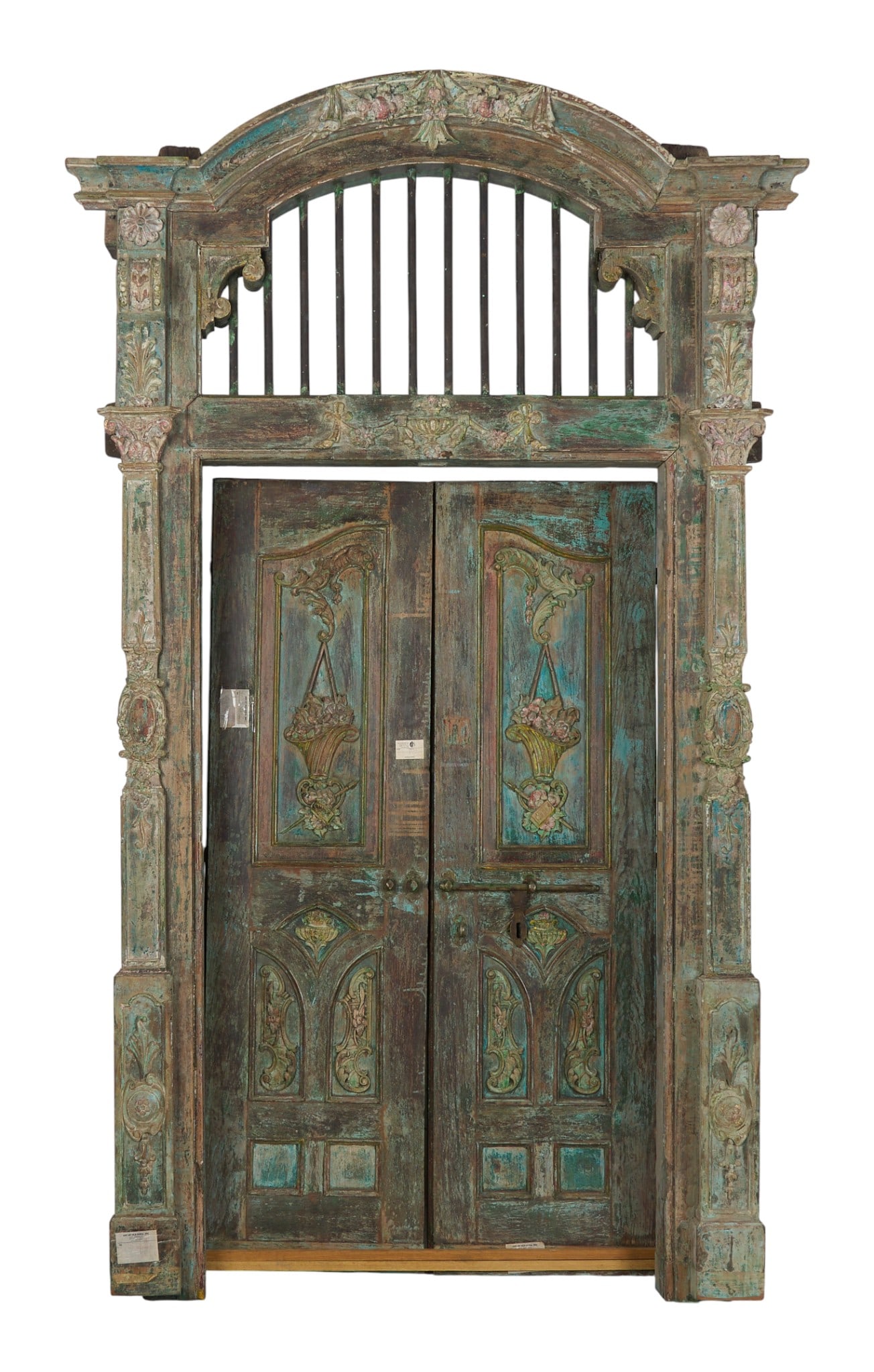 Antique French Provincial Doorway: Over-ten-foot-tall antique French Provincial style architectural doorway with two doors with carved details, transom window with iron bars,