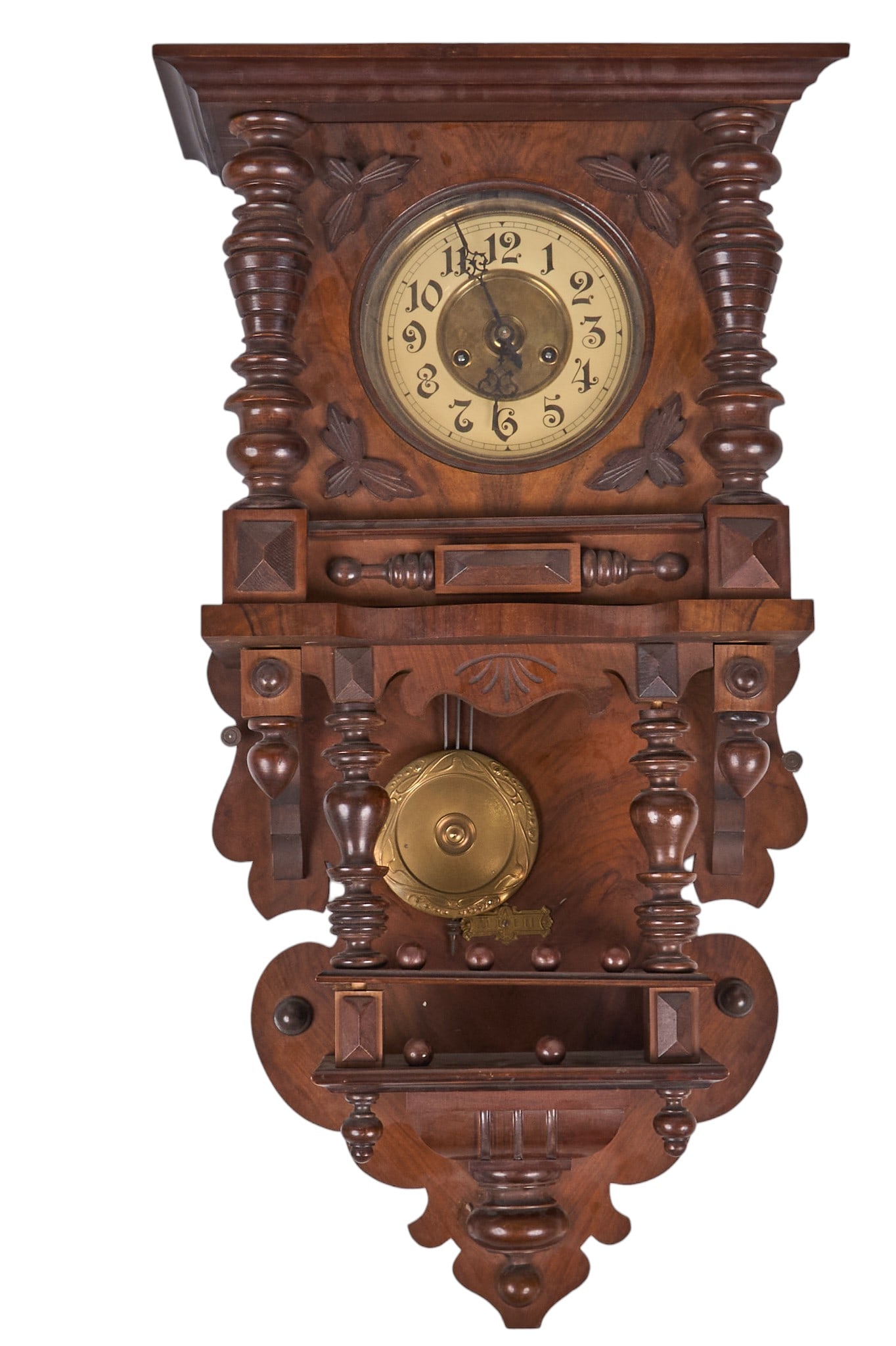 Carved Wooden Wall Clock: Ornately carved wooden wall clock with pendulum, includes hardware for hanging height 32 in. x width 17.5 in. x depth 7 in. Provenance: Property from the personal collection of a noted San Antonio, Te