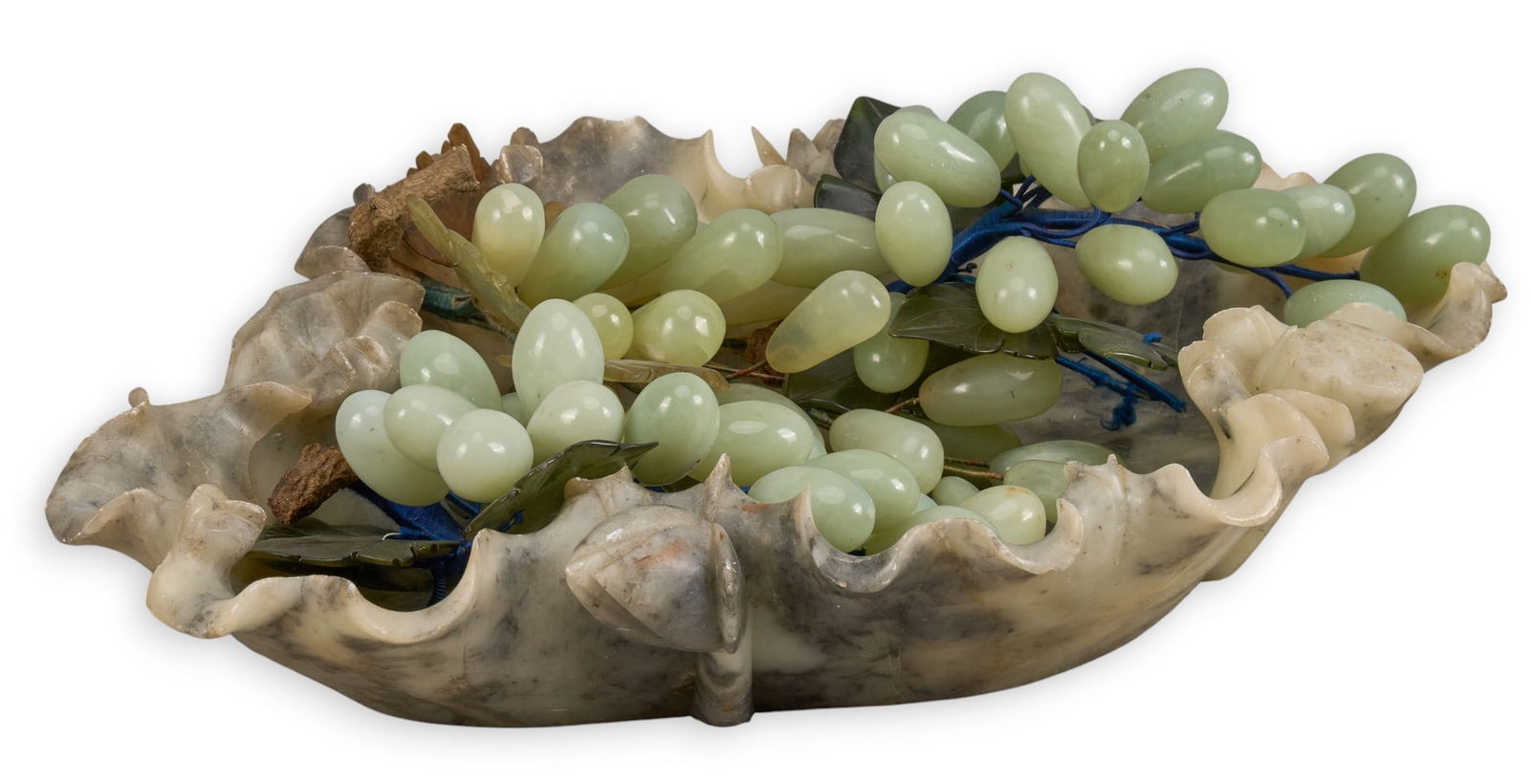 Soapstone Centerpiece: Soapstone centerpiece bowl with green quartz grapes height 3 in. x width 15 in. x depth 13 in. Provenance: Property from a home in San Antonio, Texas 