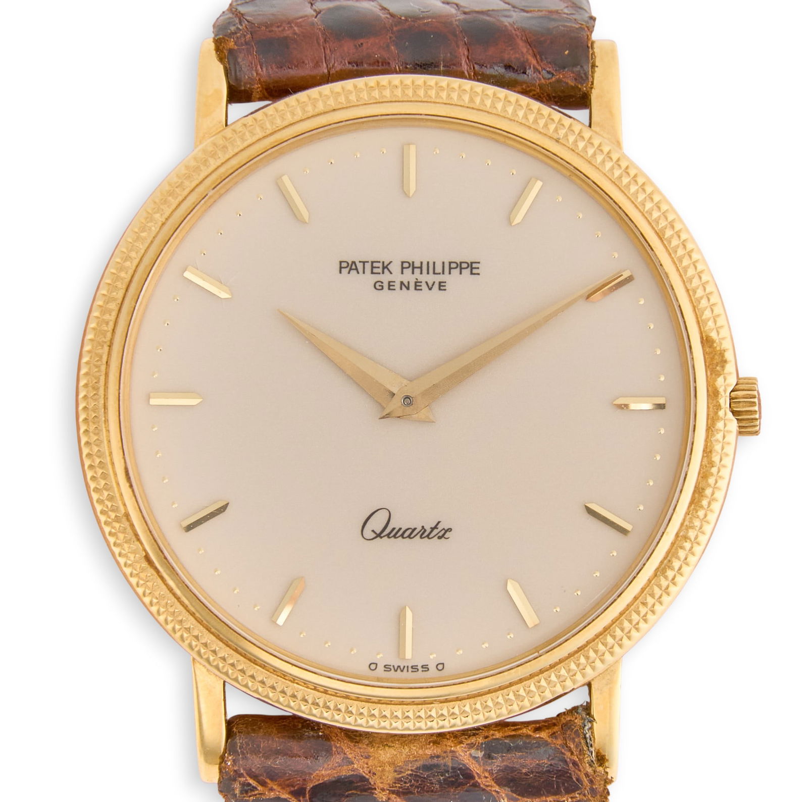 T. R. Fehrenbach | Patek Philippe Wristwatch: Patek Philippe Calatrava 18K yellow gold quartz watch, with a cream dial and Kreisler brown crocodile leather strap, marked "750" and "PPC"Dial: 28 mmProvenance: The