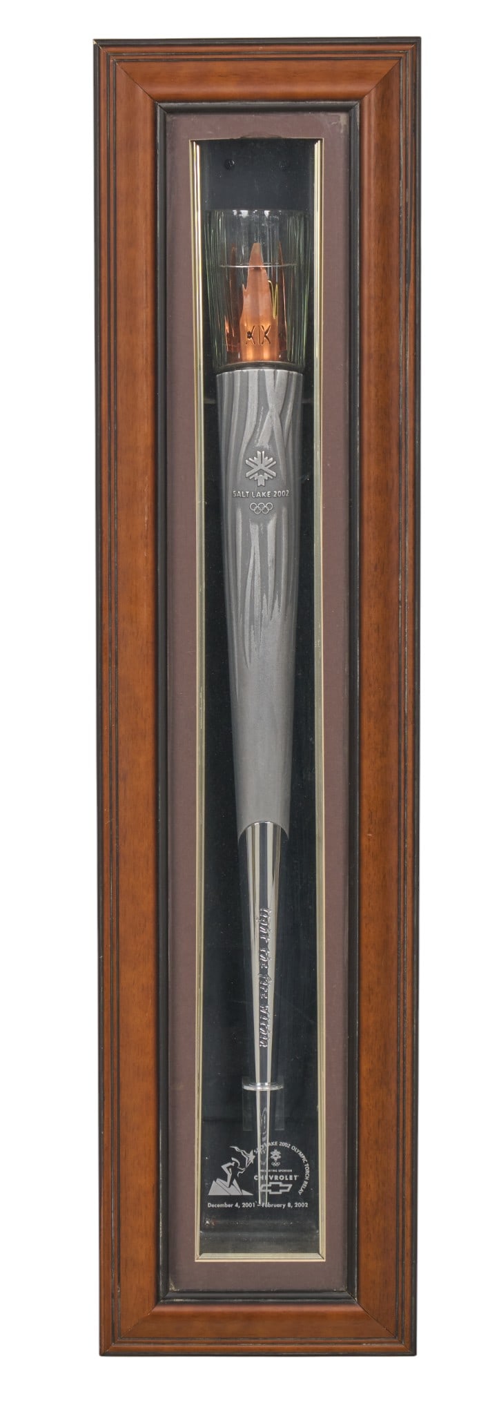 2002 Olympic Torch in Display Frame: 2002 Salt Lake City Winter Olympics torch, displayed in a custom wood and glass case, with commemorative plaqueheight 43 in. x width 10 in. x depth 4.5 in.Provenance: Property from the personal
