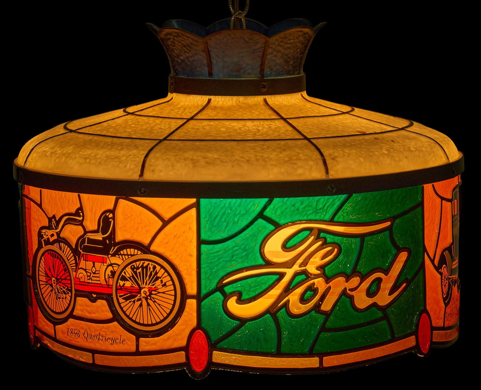 Ford Acrylic Chandelier: Vintage acrylic stained-glass style pendant lamp with design referencing various Ford Motors vehicles, in working condition, circa late 20th century height 12 in. x diameter 16