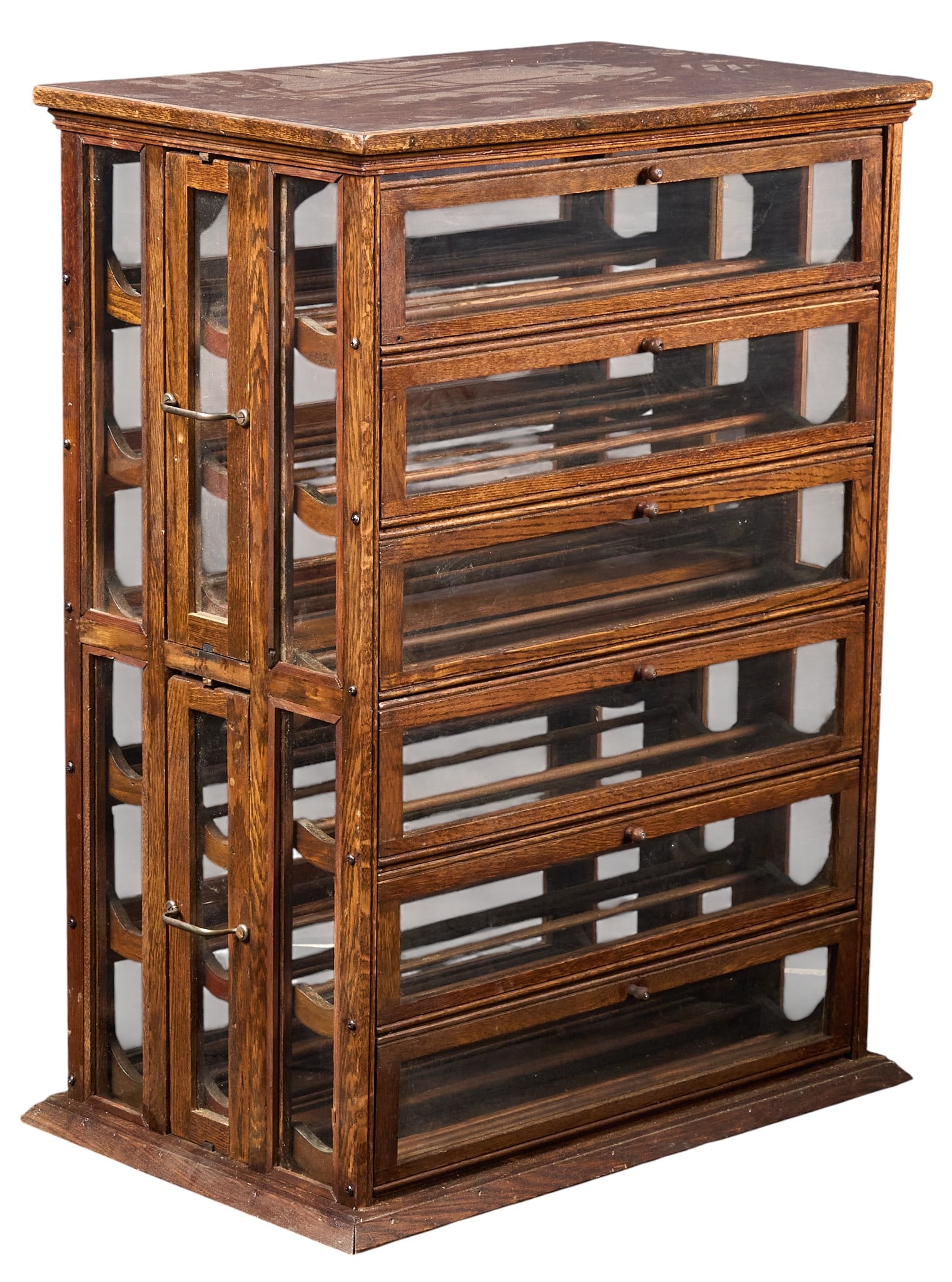 Vintage Ribbon Cabinet: Vintage wood and glass ribbon cabinet with six tiers, each with three trays of storage height 37 in. x width 29 in. x depth 17 in. Provenance: Property from a home in San Antonio, Texas