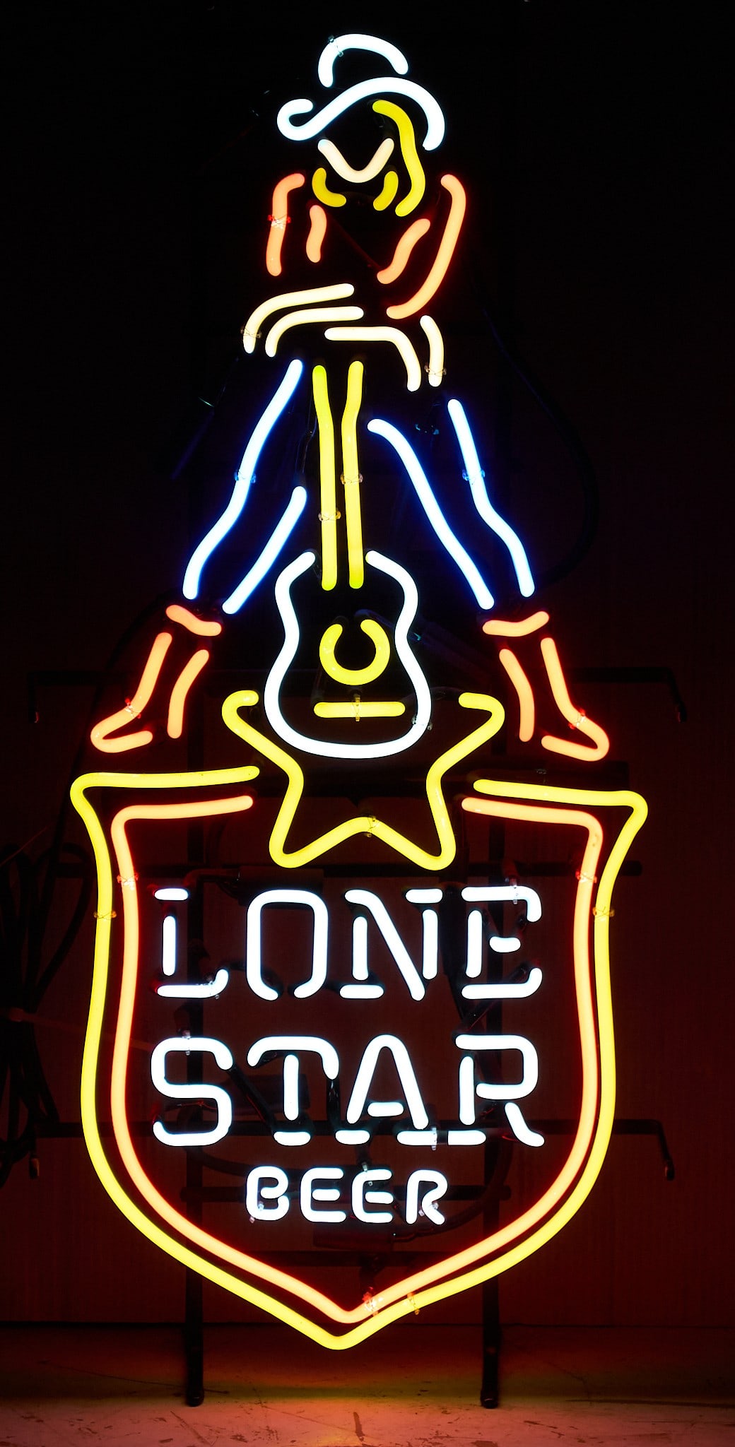 Lone Star Beer Cowgirl Guitar Neon, 21st C.: Lone Star Beer neon with shield, guitar, and cowgirl details, circa 21st centuryheight 33 in. x width 15 in. x depth 6 in. 