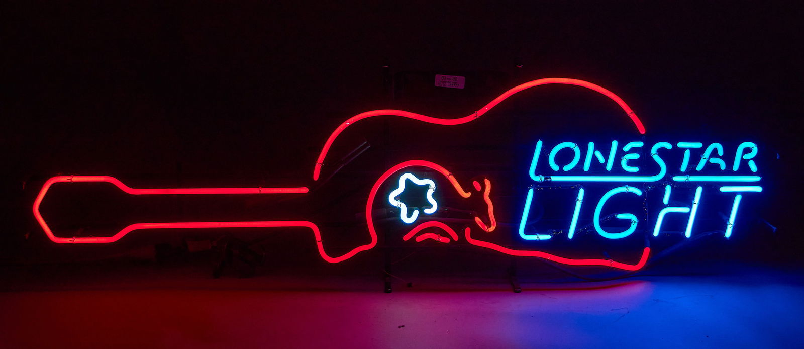 Vintage Lone Star Light Beer Guitar Neon Sign, 1990s: Vintage Lone Star Light Beer neon sign with guitar and armadillo design, circa 1990sheight 14 in. x width 46 in. x depth 6 in. Provenance: Property from a home in San Antonio, Texas