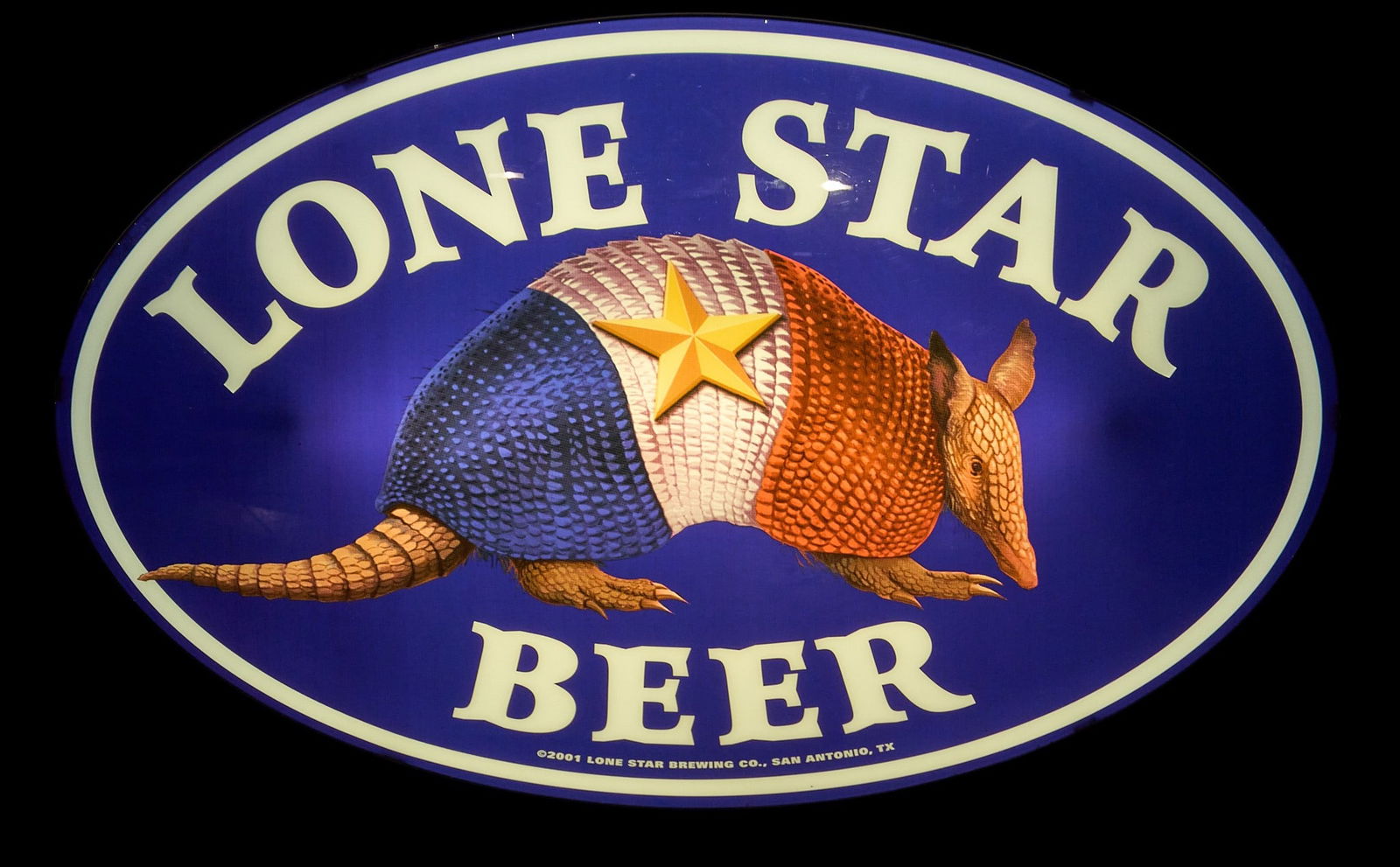 Limited Edition Lone Star Beer Lighted Sign, 2001: Vintage Lone Star Beer lighted oval box sign with armadillo, one of a limited discontinued prototype series, in working condition, circa 2001 height 23 in. x width 37 in. x depth 6