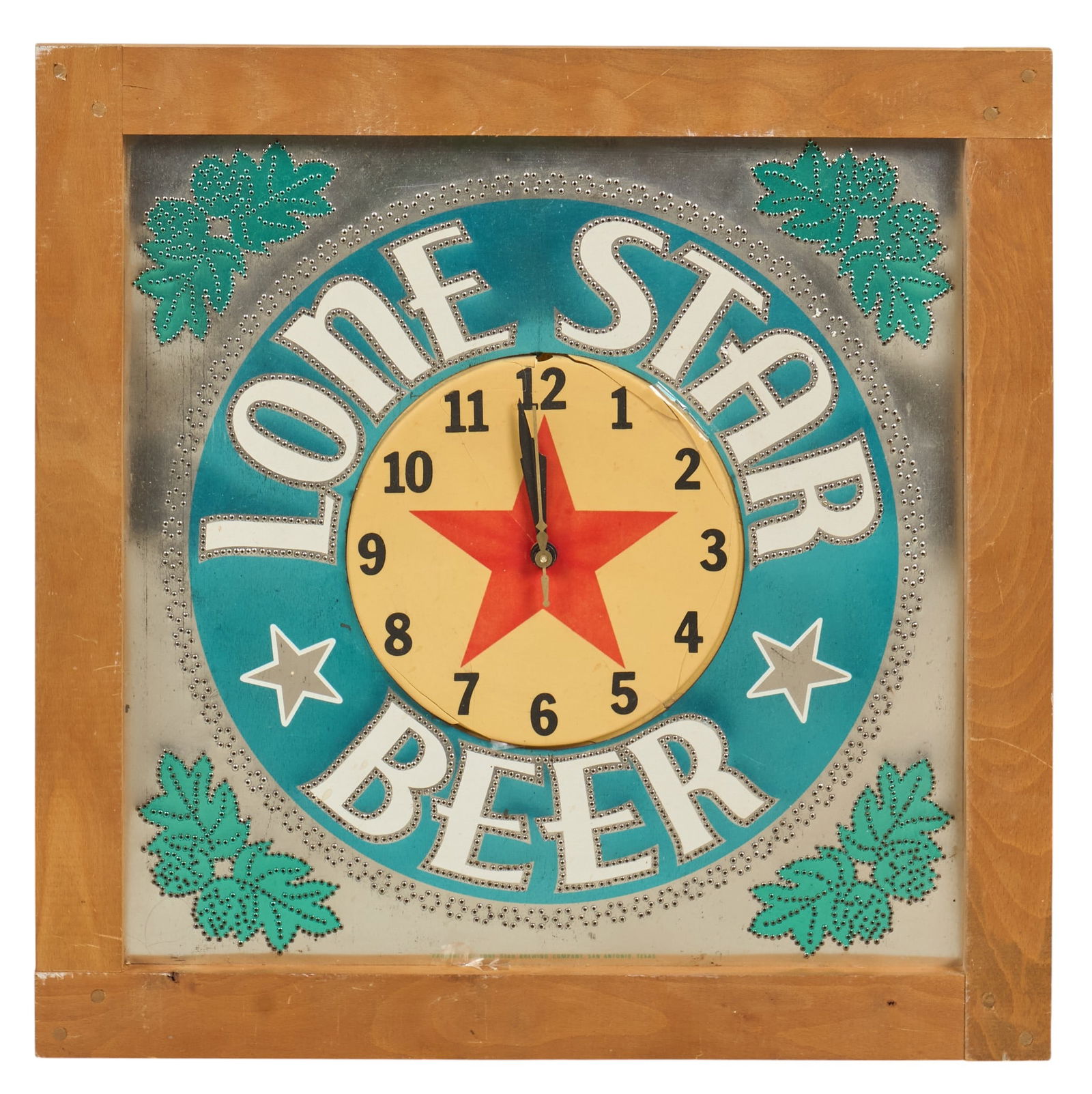 Lone Star Punched Tin Clock: Lone Star Beer punched tin clock with backlight and wooden frame, in working conditionheight 19 in. x width 19 in. x depth 4 in. Provenance: Property from a home in Seguin, Texas