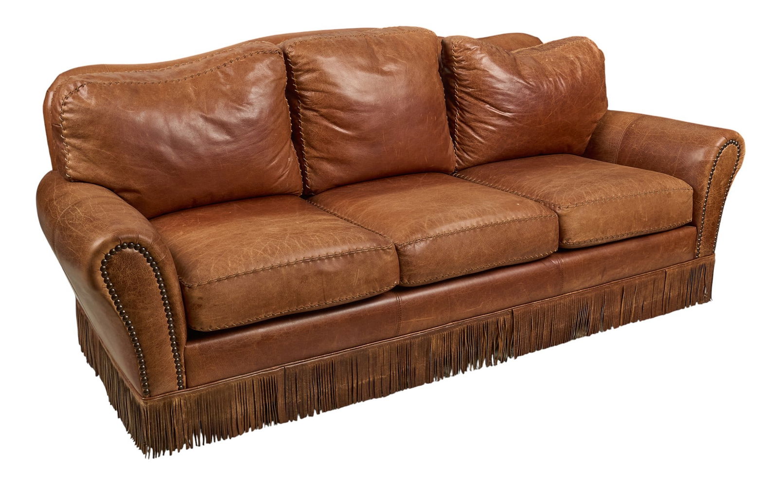 Furniture For You Leather Sofa: Furniture For You brown leather sofa with fringe detail height 39 in. x width 91 in. x depth 39 in. Provenance: Property from a home in San Antonio, Texas 