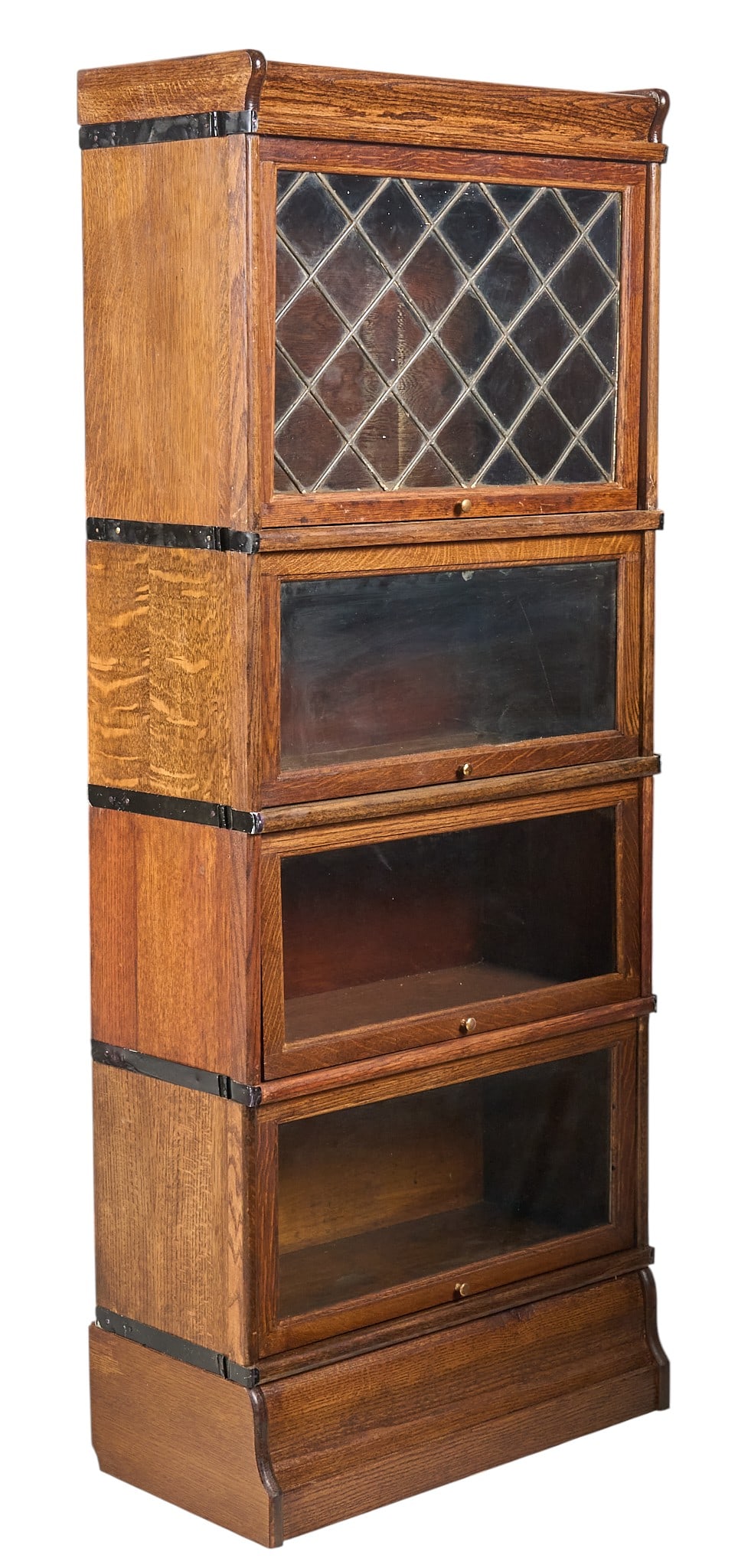 Vintage Stacking Bookcase: Vintage stacking bookcase with four tiers of storage, with leaded glass decoration in top tier moduleheight 63 in. x width 26 in. x width 12 in. Provenance: Property from a home in San