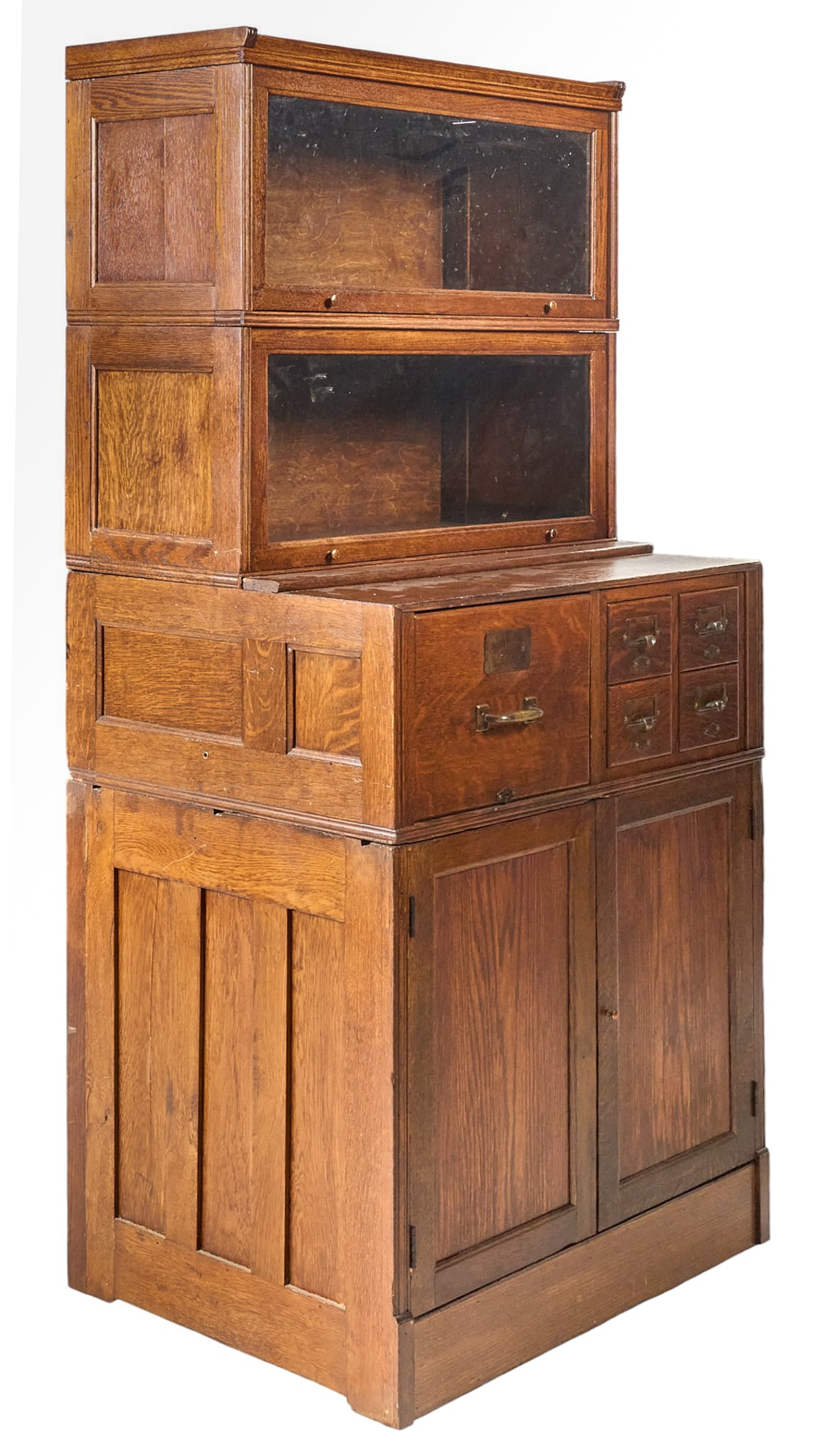 Vintage Bookcase: Vintage bookcase with two tiers of glass-front cabinets, five drawers, and bottom pair of paneled cabiet doorsheight 71 in. x widht 33 in. x depth 26 in. Provenance: Property from a home in San