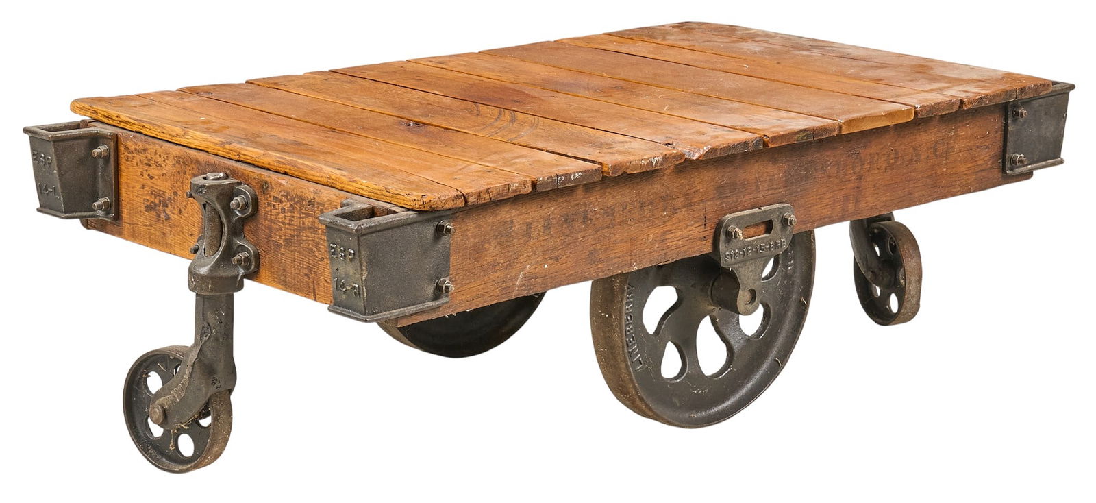 Industrial Railcar Coffee Table: Industrial style coffee table constructed from a reclaimed railcar, with wooden plank top and heavy-duty metal wheels. height 16 in. x wdith 55 in. x depth 27 in. Provenance: Property from
